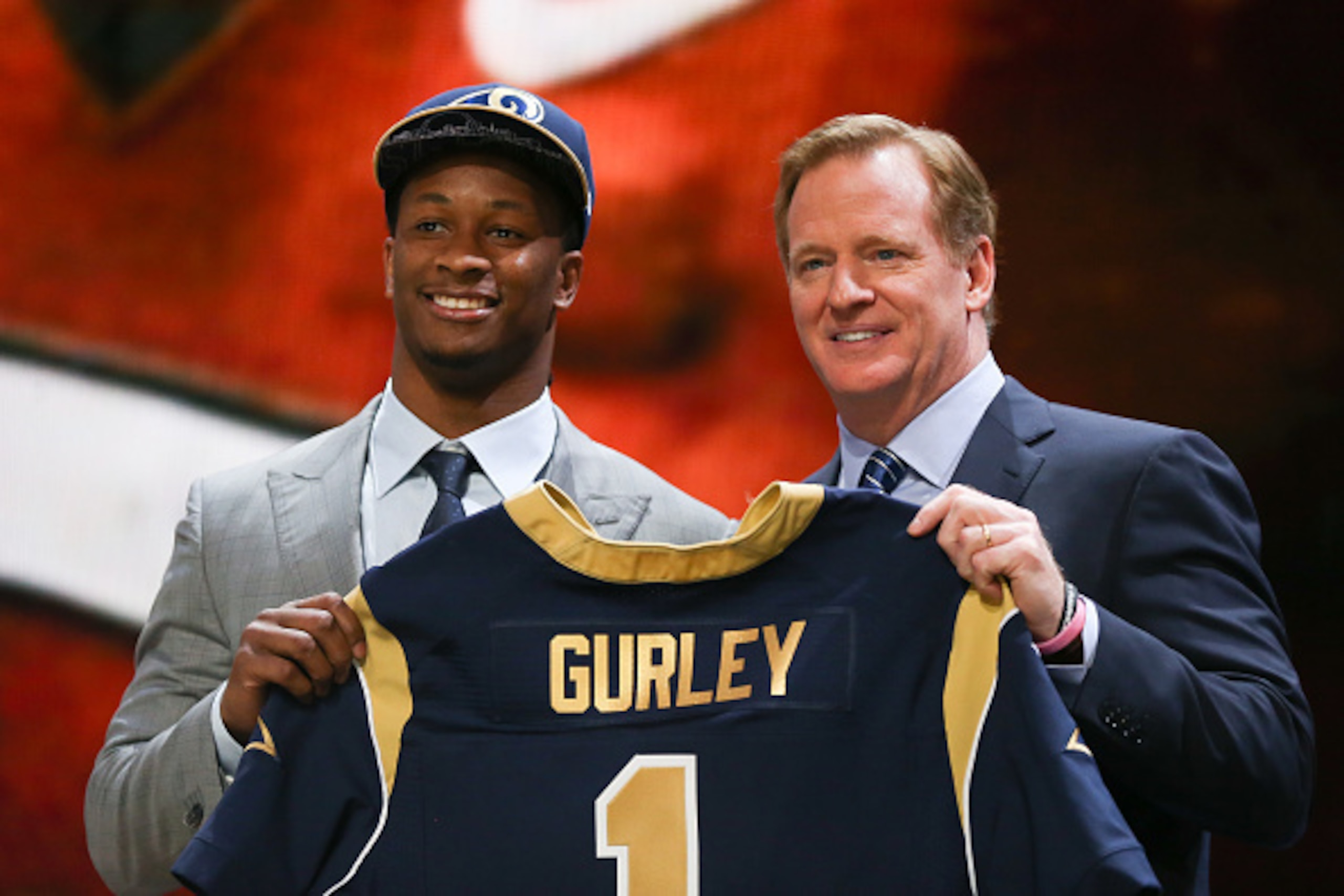 CHICAGO, IL - APRIL 30:  Todd Gurley of the Georgia Bulldogs holds up a jersey with NFL Commissioner Roger Goodell after being picked #10 overall by the St. Louis Rams during the first round of the 2015 NFL Draft at the Auditorium Theatre of Roosevelt Uni