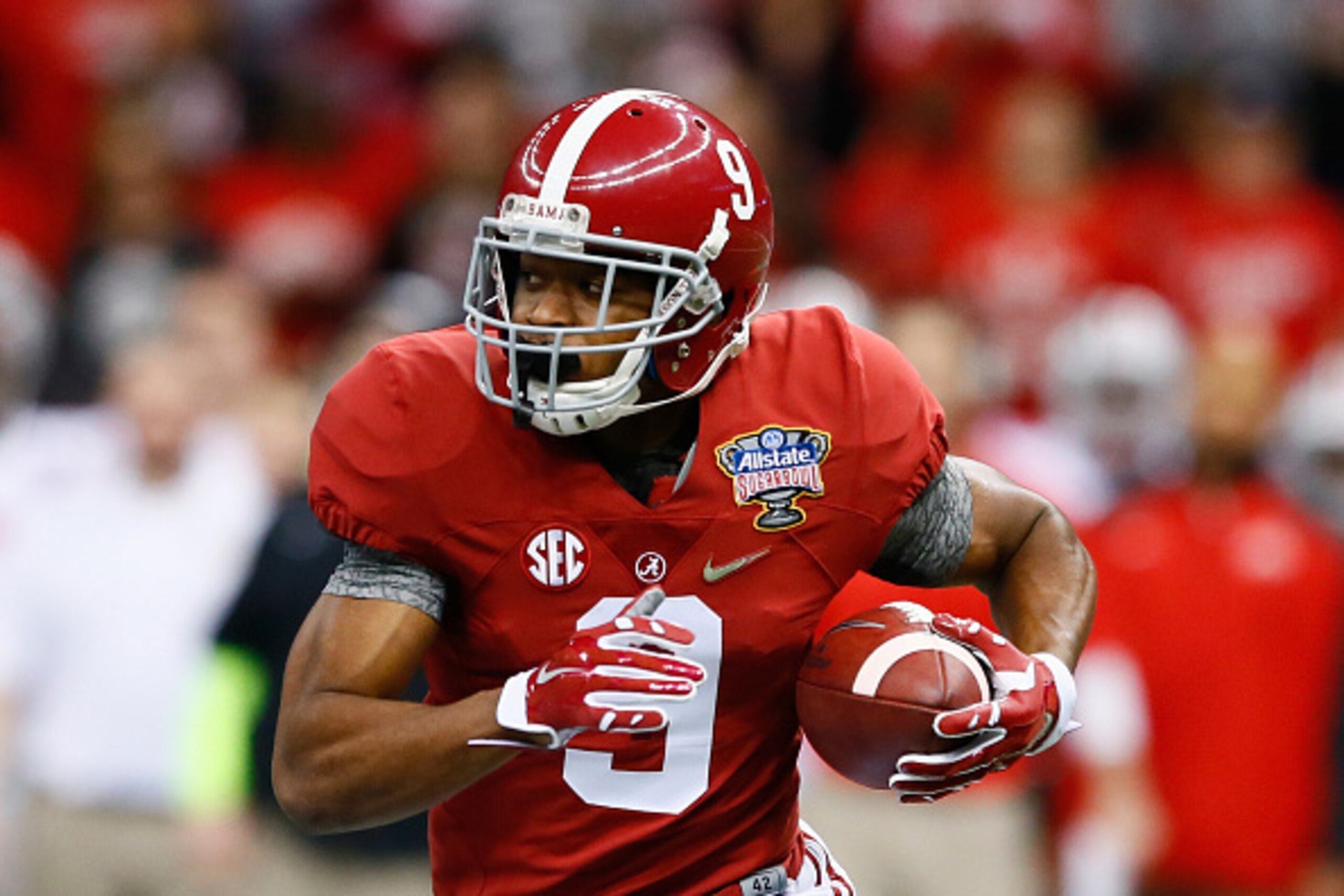 NEW ORLEANS, LA - JANUARY 01:  Amari Cooper #9 of the Alabama Crimson Tide runs the ball in the first quarter against the Ohio State Buckeyes during the All State Sugar Bowl at the Mercedes-Benz Superdome on January 1, 2015 in New Orleans, Louisiana.  (Ph