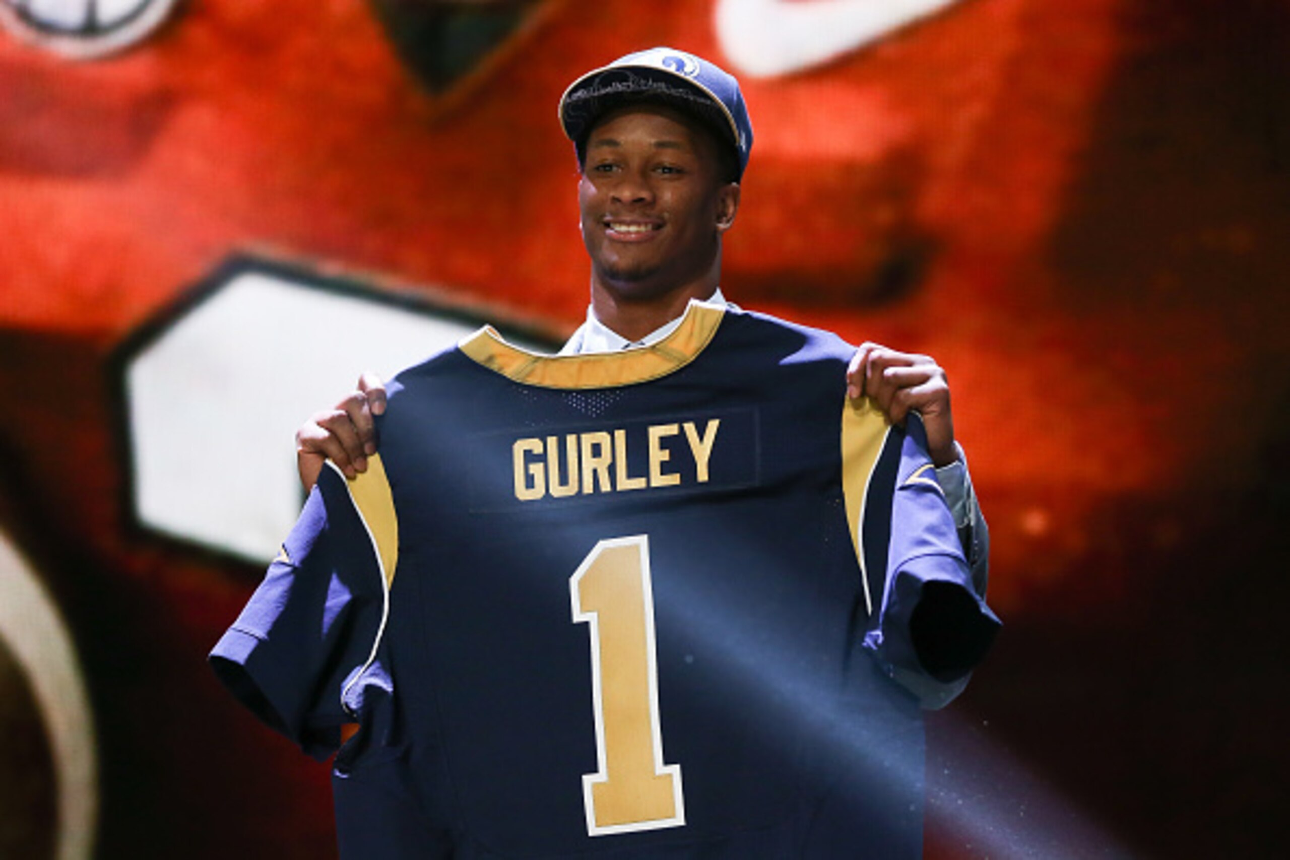 CHICAGO, IL - APRIL 30:  Todd Gurley of the Georgia Bulldogs holds up a jersey after being picked #10 overall by the St. Louis Rams during the first round of the 2015 NFL Draft at the Auditorium Theatre of Roosevelt University on April 30, 2015 in Chicago
