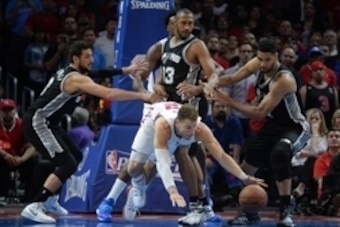 Apr 28, 2015; Los Angeles, CA, USA; Los Angeles Clippers forward Blake Griffin (32) and San Antonio Spurs players Marco Belinelli (3) and Boris Diaw (33) and Tim Duncan (21) pursue a loose ball in game five of the first round of the NBA Playoffs at Staple