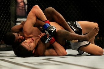 NEWARK, NJ - APRIL 18:  Takeya Mizugaki of Japan and Aljamain Sterling grapple in their bantamweight bout during the UFC Fight Night event at Prudential Center on April 18, 2015 in Newark, New Jersey.  (Photo by Alex Trautwig/Getty Images)