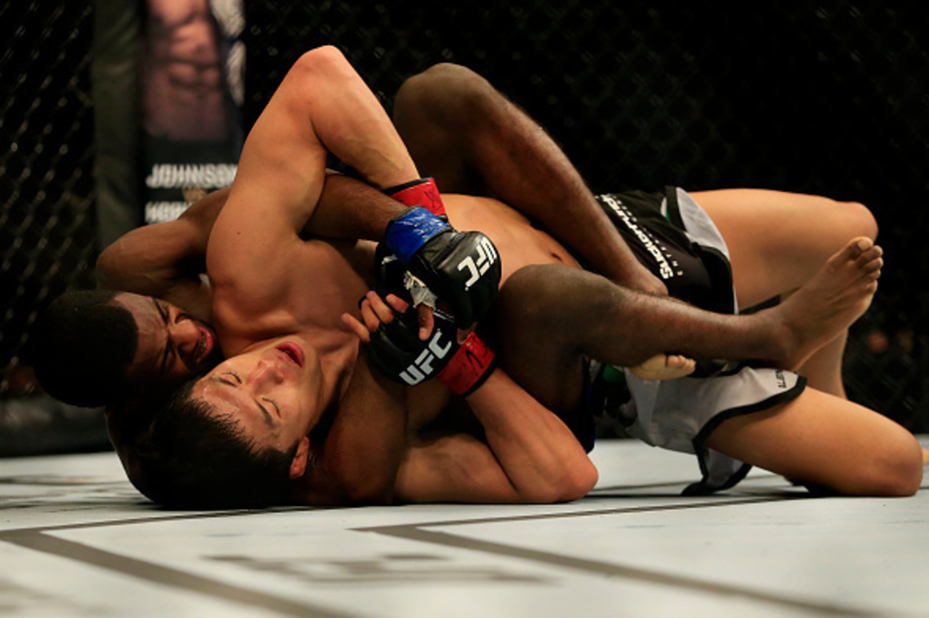 NEWARK, NJ - APRIL 18:  Takeya Mizugaki of Japan and Aljamain Sterling grapple in their bantamweight bout during the UFC Fight Night event at Prudential Center on April 18, 2015 in Newark, New Jersey.  (Photo by Alex Trautwig/Getty Images)