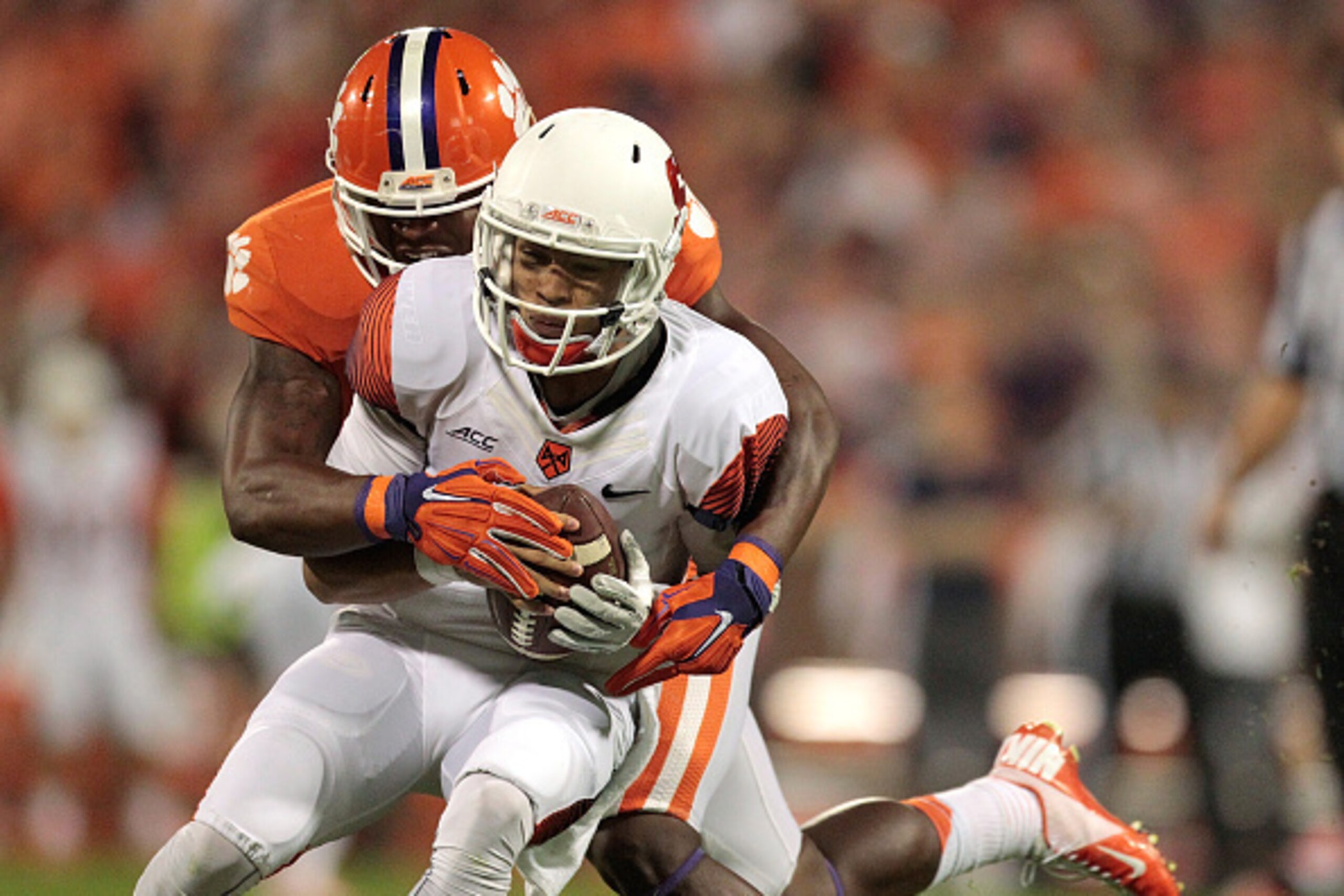CLEMSON, SC - OCTOBER 25: Stephone Anthony #42 of the Clemson Tigers sacks AJ Long #4 of the Syracuse Orange during the game at Memorial Stadium on October 25, 2014 in Clemson, South Carolina. (Photo by Tyler Smith/Getty Images)