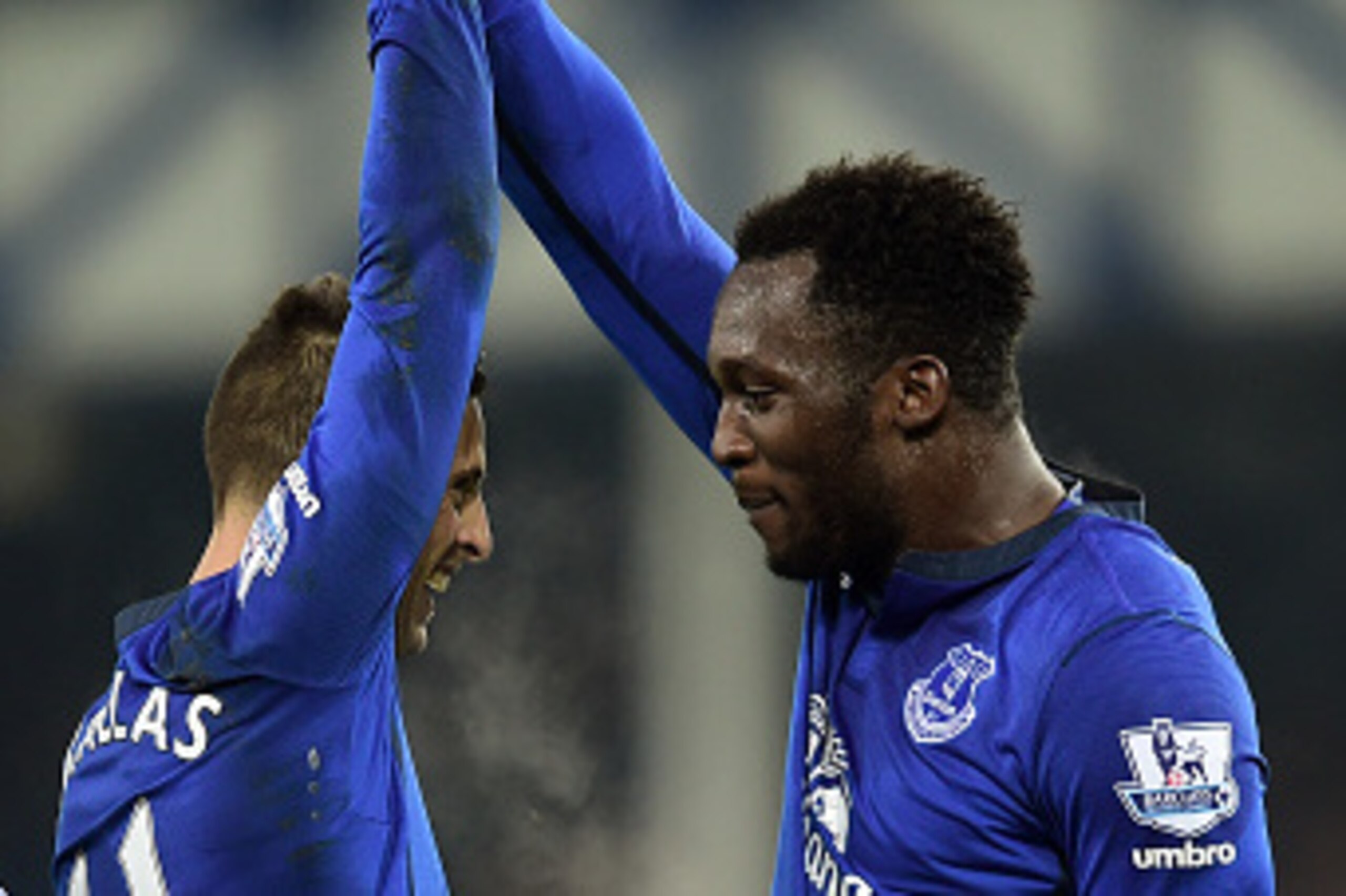 LIVERPOOL, ENGLAND - DECEMBER 03:  Romelu Lukaku #10 of Everton celebrates with teammate Kevin Mirallas of Everton after scoring the opening goal during the Barclays Premier League match between Everton and Hull City at Goodison Park on December 3, 2014 i