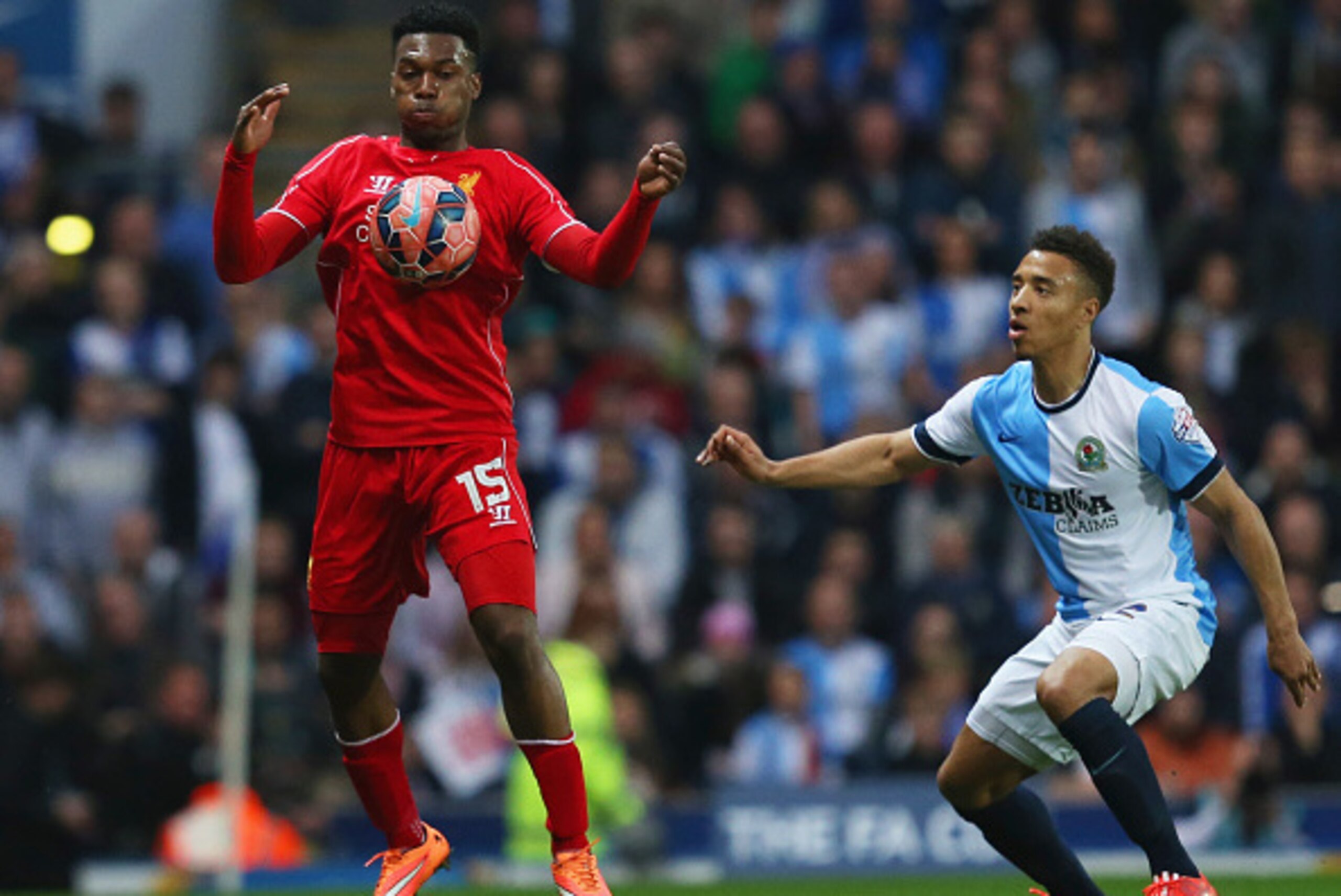BLACKBURN, ENGLAND - APRIL 08:  Daniel Sturridge of Liverpool controls the ball from Adam Henley of Blackburn Rovers during the FA Cup Quarter Final Replay match between Blackburn Rovers and Liverpool at Ewood Park on April 8, 2015 in Blackburn, England. 