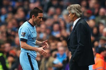 MANCHESTER, ENGLAND - APRIL 25: Frank Lampard of Manchester City shakes hands with Manuel Pellegrini, manager of Manchester City as he is substituted during the Barclays Premier League match between Manchester City and Aston Villa at Etihad Stadium on Apr