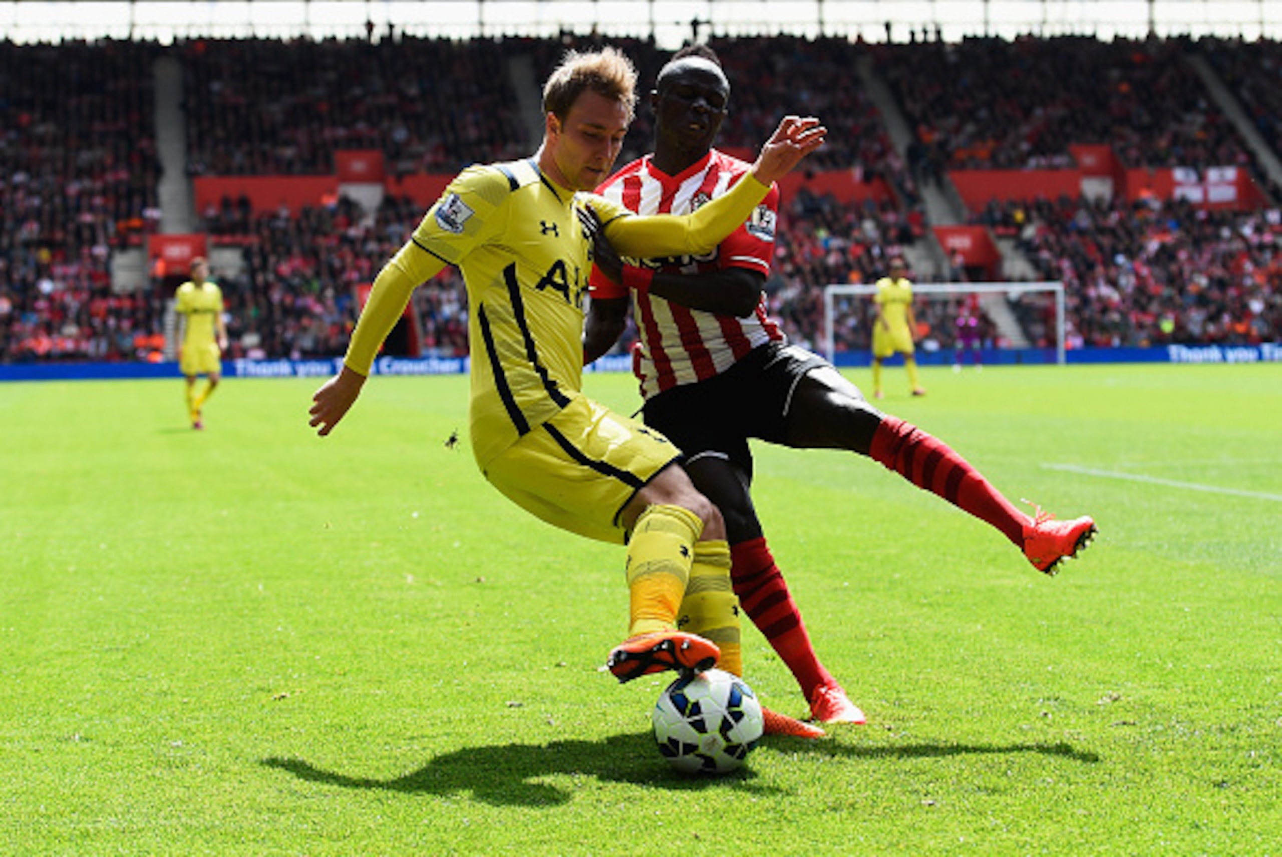 SOUTHAMPTON, ENGLAND - APRIL 25:  Christian Eriksen of Spurs battles with Sadio Mane of Southampton during the Barclays Premier League match between Southampton and Tottenham Hotspur at St Mary's Stadium on April 25, 2015 in Southampton, England.  (Photo 