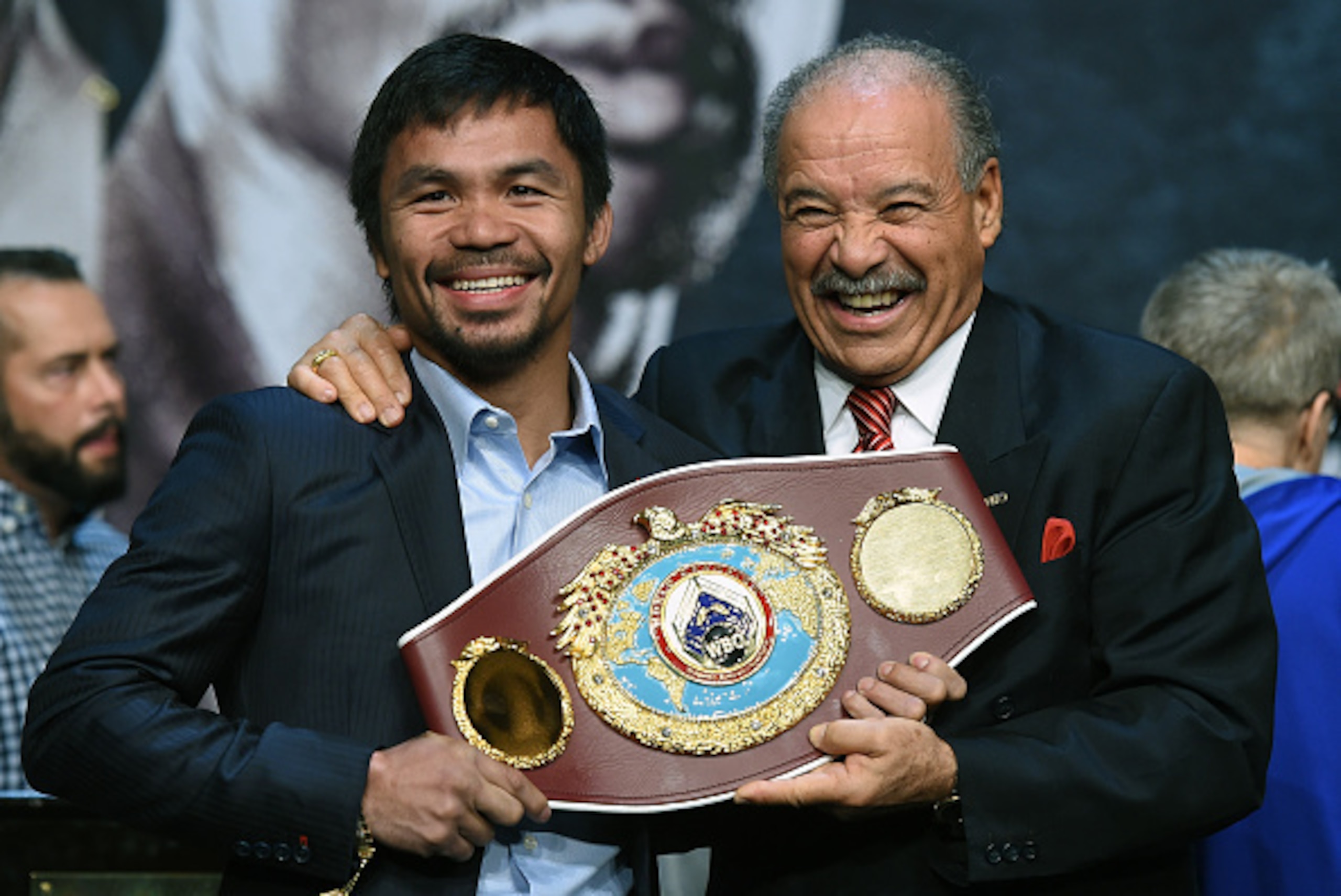 LAS VEGAS, NV - APRIL 29:  WBO welterweight champion Manny Pacquiao (L) and WBO President Francisco 'Paco' Valcarcel hold the WBO championship belt during a news conference at the KA Theatre at MGM Grand Hotel & Casino on April 29, 2015 in Las Vegas, Neva