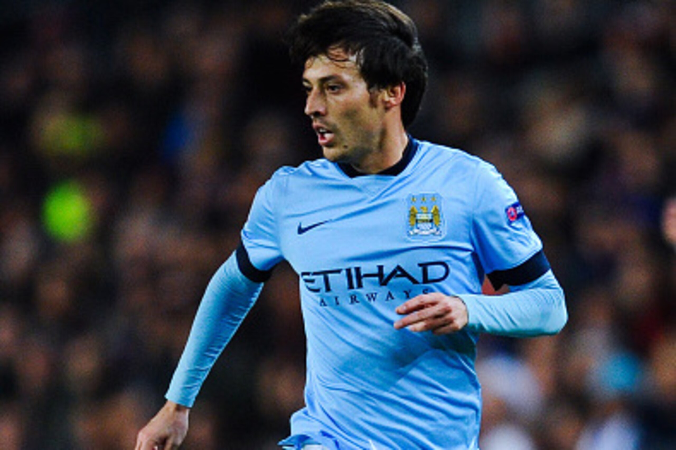 BARCELONA, SPAIN - MARCH 18:  David Silva of Manchester City FC runs with the ball during the UEFA Champions League round of 16 second leg match between FC Barcelona and Manchester City at the Camp Nou stadium on March 18, 2015 in Barcelona, Spain.  (Phot