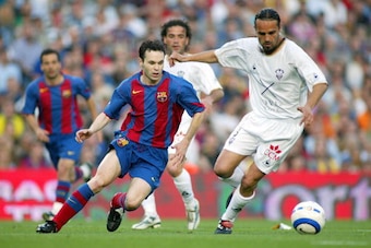 BARCELONA, SPAIN - MAY 1:  Andres Iniesta of FC Barcelona and Carles Mingo of Albacete in action during the La Liga match between FC Barcelona and Albacete on May 1, 2005 at Nou Camp Stadium in Barcelona, Spain.  (Photo by Luis Bagu/Getty Images)