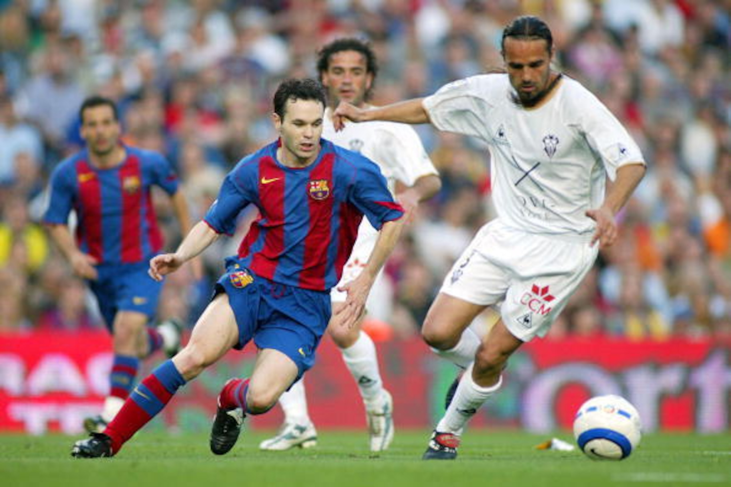 BARCELONA, SPAIN - MAY 1:  Andres Iniesta of FC Barcelona and Carles Mingo of Albacete in action during the La Liga match between FC Barcelona and Albacete on May 1, 2005 at Nou Camp Stadium in Barcelona, Spain.  (Photo by Luis Bagu/Getty Images)