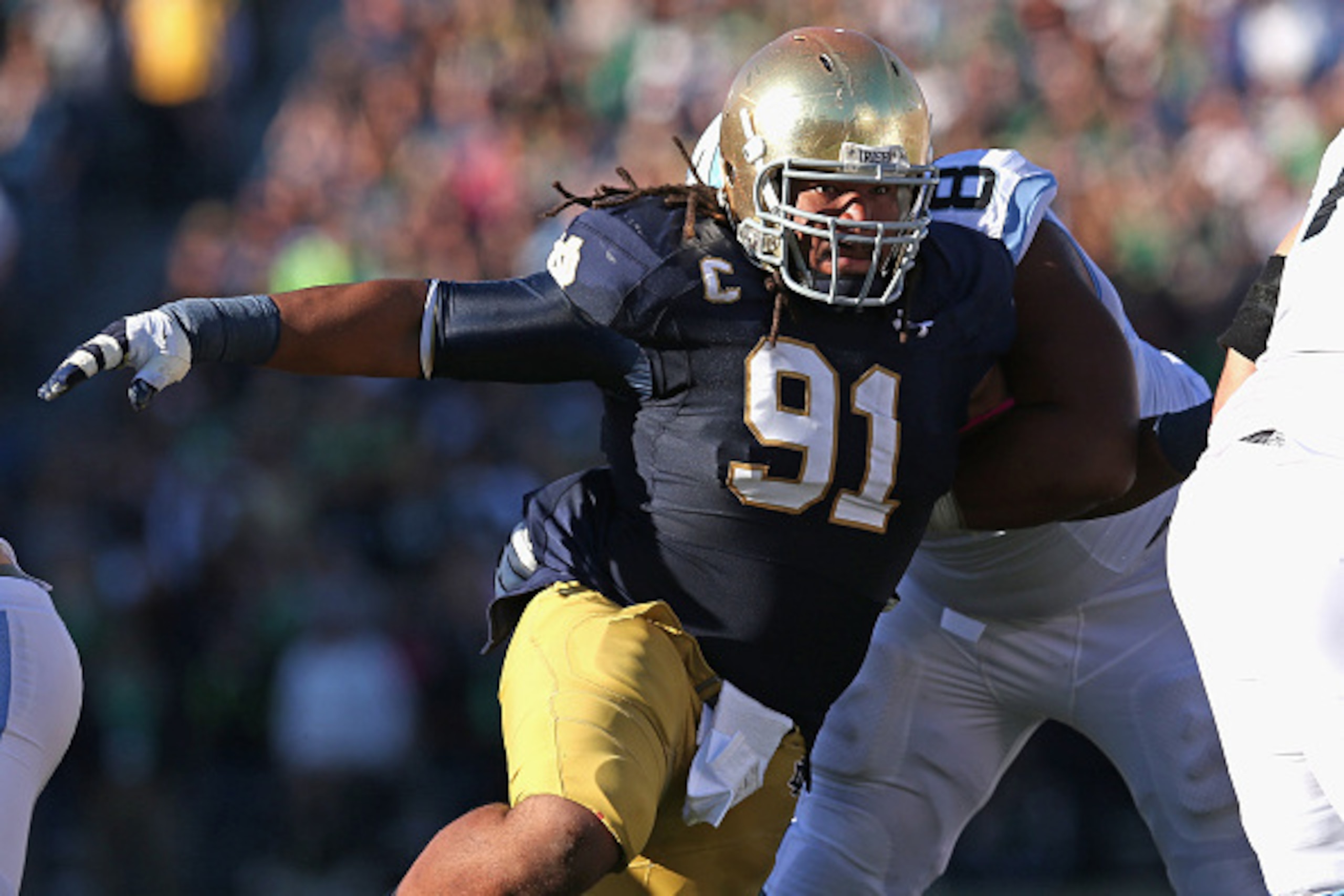 SOUTH BEND, IN - OCTOBER 11: Sheldon Day #91 of the Notre Dame Fighting Irish rushes past Landon Turner #78 of the North Carolina Tar Heels at Notre Dame Stadium on October 11, 2014 in South Bend, Indiana. (Photo by Jonathan Daniel/Getty Images)