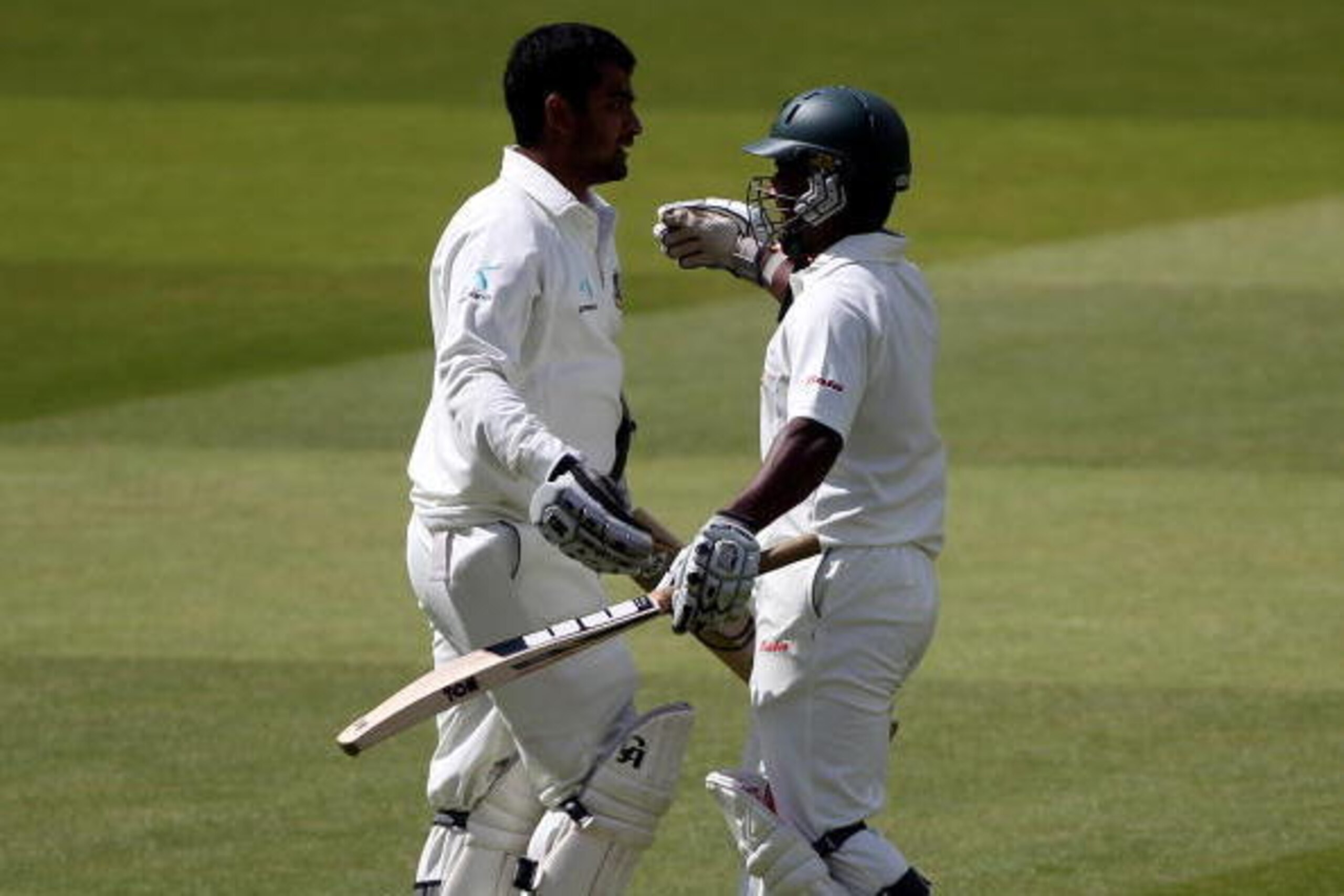 LONDON, ENGLAND - MAY 30: Imrul Kayes (R) of Bangladesh congratulates his team mate Tamim Iqbal on reaching his 100 during day four of the 1st npower Test between England and Bangladesh played at Lords on May 30, 2010 in London, England.  (Photo by Julian