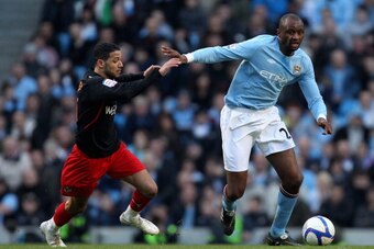 MANCHESTER, ENGLAND - MARCH 13:  Patrick Vieira of Manchester City holds off the challenge by Jobi McAnuff of Reading during the FA Cup sponsored by E.On Sixth Round match between Manchester City and Reading at the City of Manchester Stadium on March 13, 