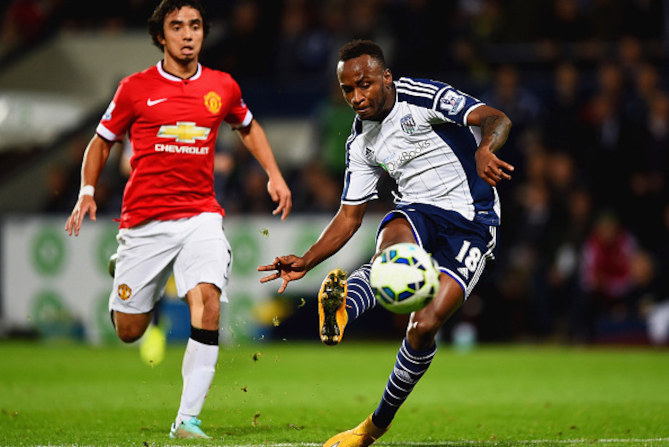 WEST BROMWICH, ENGLAND - OCTOBER 20: Saido Berahino of West Bromwich Albion scores their second goal as Rafael of Manchester United looks on during the Barclays Premier League match between West Bromwich Albion and Manchester United at The Hawthorns on O WEST BROMWICH, ENGLAND - OCTOBER 20: Saido Berahino of West Bromwich Albion scores their second goal as Rafael of Manchester United looks on during the Barclays Premier League match between West Bromwich Albion and Manchester United at The Hawthorns on O