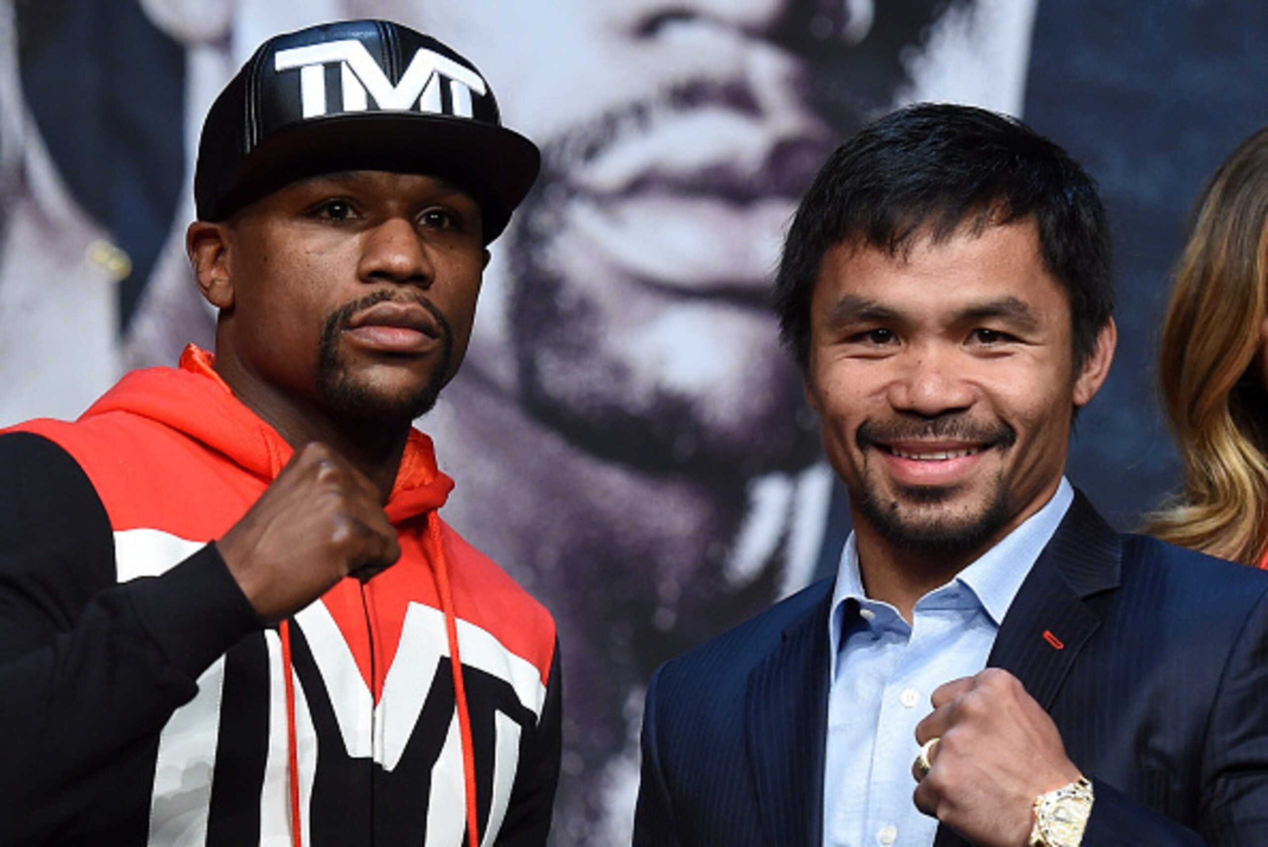 LAS VEGAS, NV - APRIL 29:  WBC/WBA welterweight champion Floyd Mayweather Jr. (L) and WBO welterweight champion Manny Pacquiao pose during a news conference at the KA Theatre at MGM Grand Hotel & Casino on April 29, 2015 in Las Vegas, Nevada. The two will