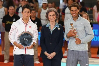 MADRID, SPAIN - MAY 11:  Rafael Nadal of Spain and  Kei Nishikori of Japan pose for a photograph with Queen Sofia of Spain as they hold their trophies after Nishikori retired injured in the third set in their final match during day nine of the Mutua Madri