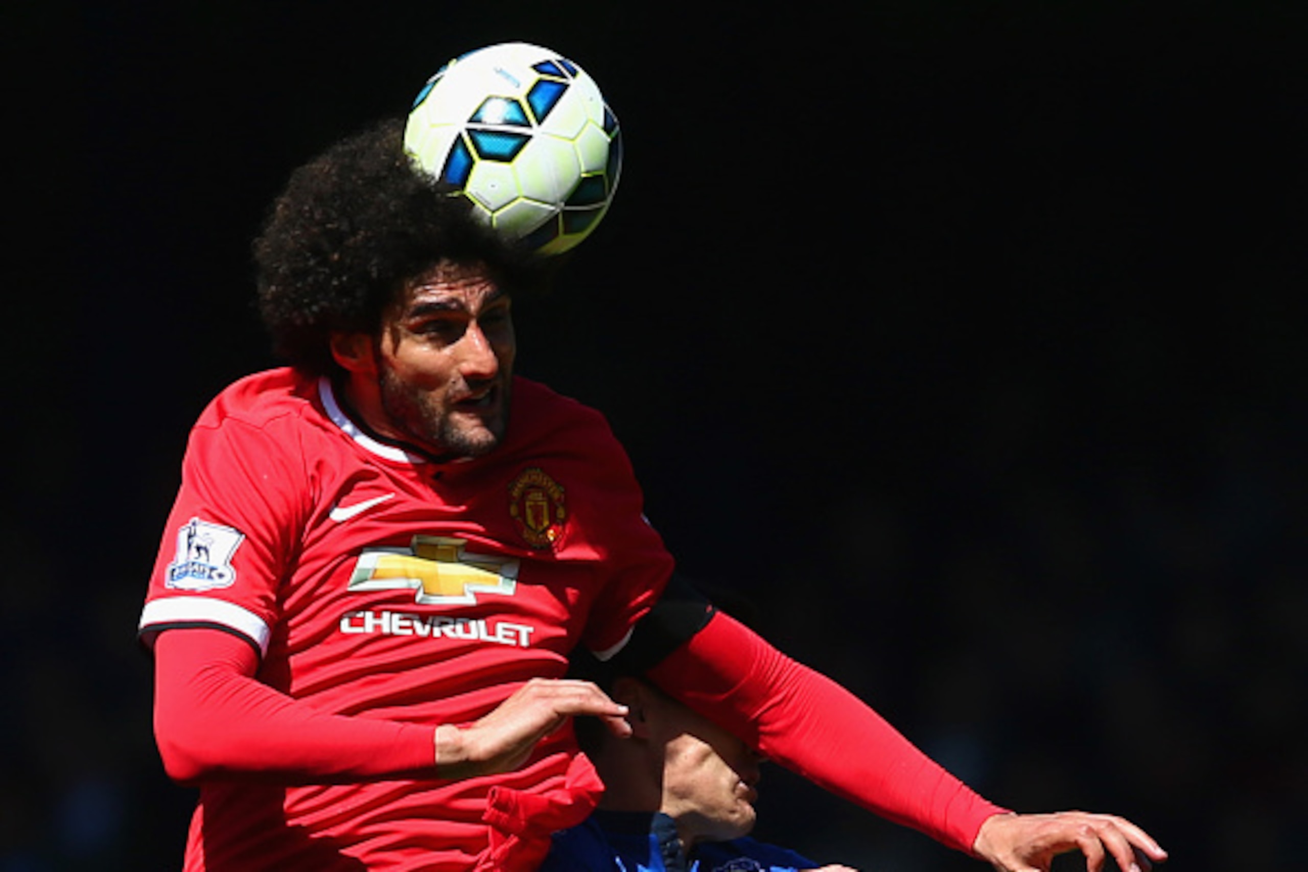 LIVERPOOL, ENGLAND - APRIL 26:  Marouane Fellaini of Manchester United outjumps Gareth Barry of Everton during the Barclays Premier League match between Everton and Manchester United at Goodison Park on April 26, 2015 in Liverpool, England.  (Photo by Cli