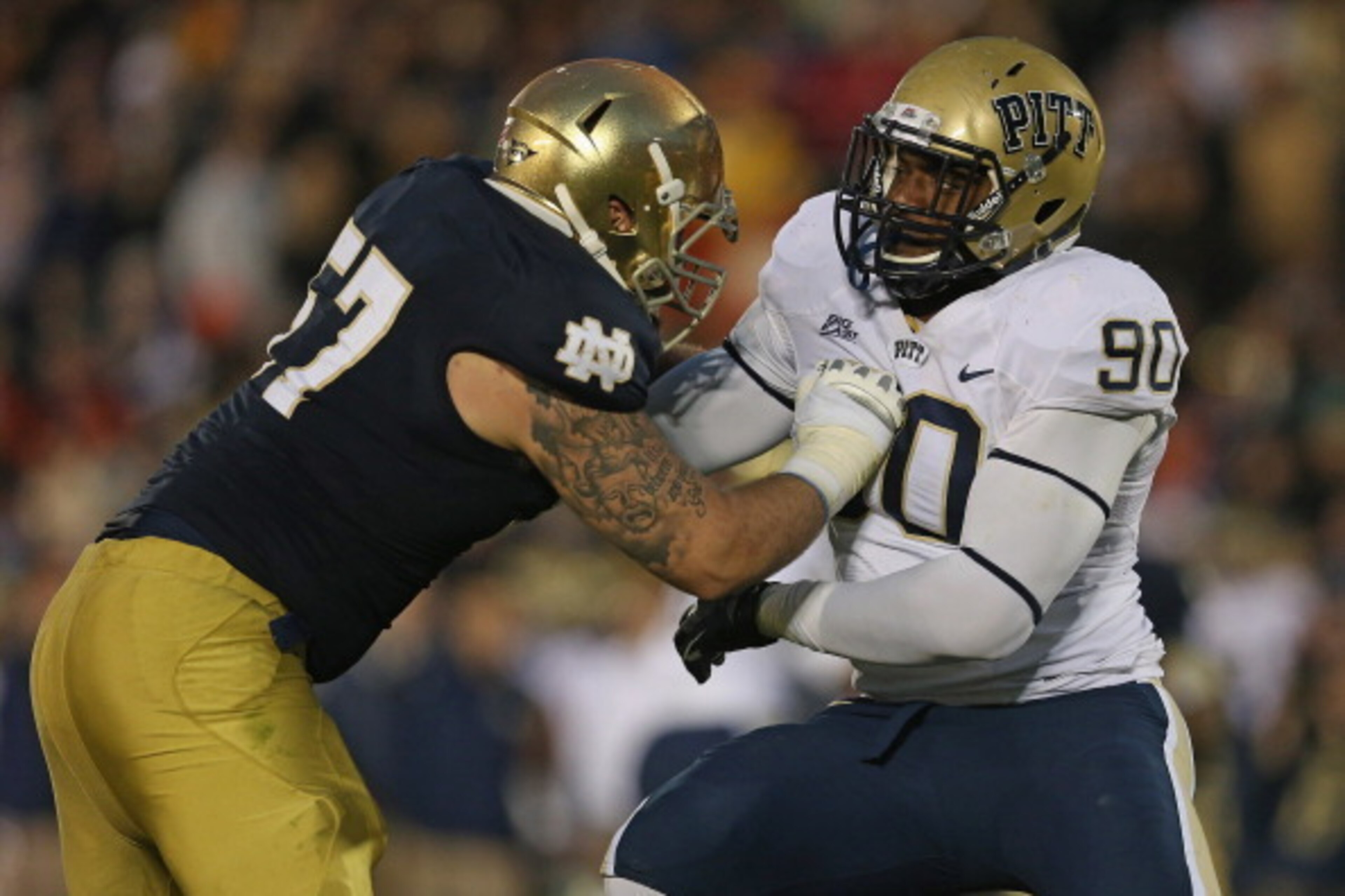 SOUTH BEND, IN - NOVEMBER 03: T.J. Clemmings #90 of the Pittsburgh Panthers rushes against Mike Golic, Jr. #57 of the Notre Dame Fighting Irish at Notre Dame Stadium on November 3, 2012 in South Bend, Indiana. Notre Dame defeated Pittsburgh 29-26 in trip SOUTH BEND, IN - NOVEMBER 03: T.J. Clemmings #90 of the Pittsburgh Panthers rushes against Mike Golic, Jr. #57 of the Notre Dame Fighting Irish at Notre Dame Stadium on November 3, 2012 in South Bend, Indiana. Notre Dame defeated Pittsburgh 29-26 in trip