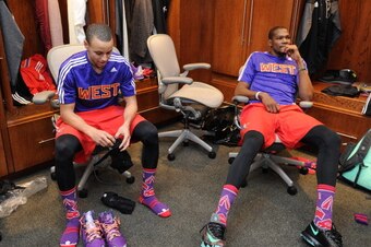 NEW ORLEANS, LA - FEBRUARY 16: Stephen Curry #30 and Kevin Durant #35 of the Western Conference All-Stars sit in the locker room before the 2014 NBA All-Star Game as part of the 2014 All-Star Weekend at Smoothie King Center on February 16, 2014 in New Orl