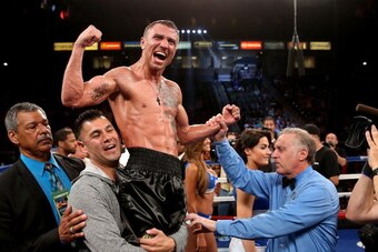 LOS ANGELES, CA - JUNE 21:  Vasyl Lomachenko celebrates after hearing the decision against Gary Russell Jr. in their WBO Featherwieight Title bout at StubHub Center on June 21, 2014 in Los Angeles, California.  Lomachenko won by split decision.  (Photo by