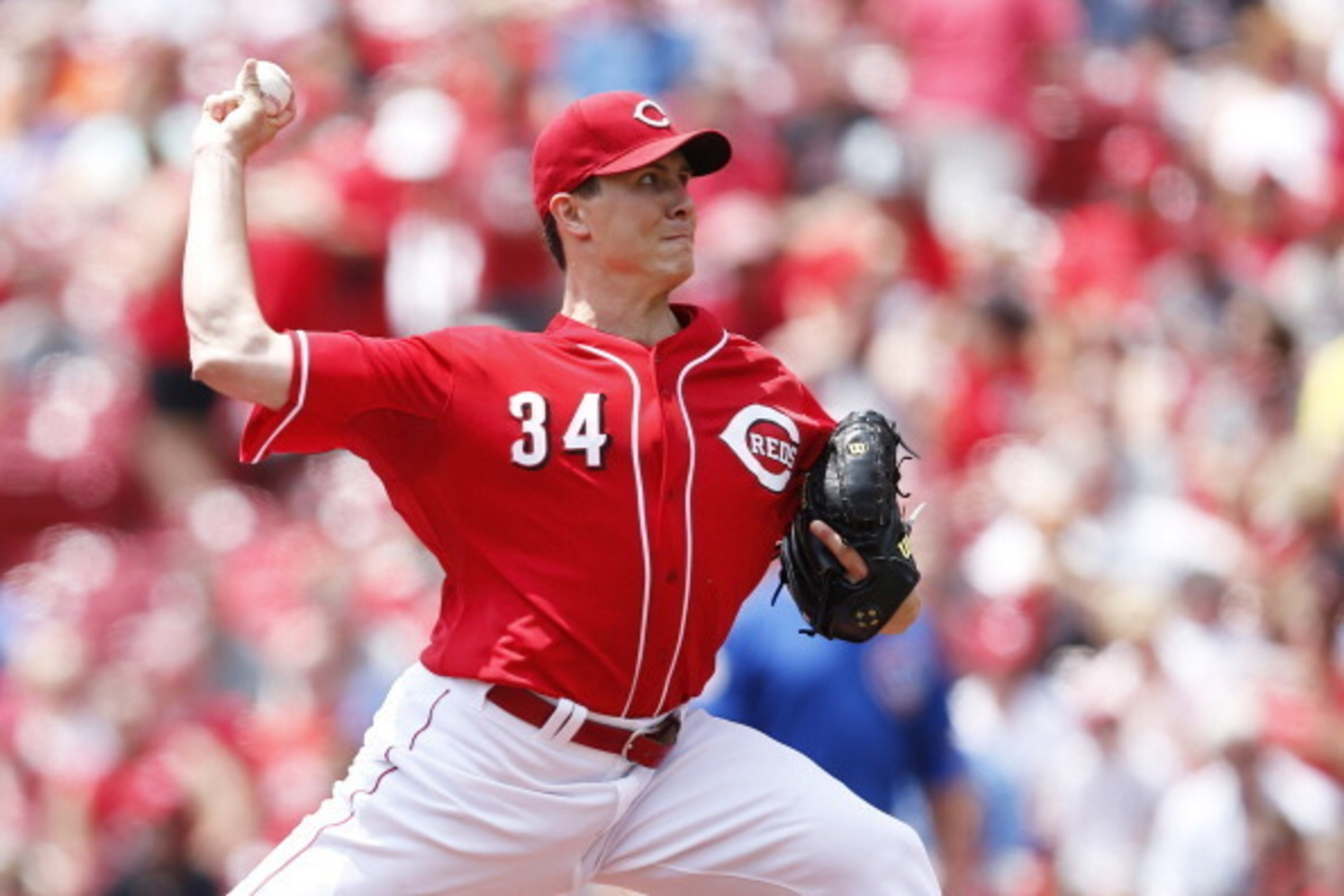 CINCINNATI, OH - JULY 10: Homer Bailey #34 of the Cincinnati Reds pitches in the first inning of the game against the Chicago Cubs at Great American Ball Park on July 10, 2014 in Cincinnati, Ohio. (Photo by Joe Robbins/Getty Images)