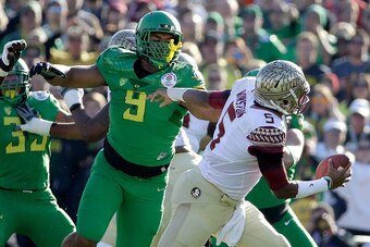 PASADENA, CA - JANUARY 01:  Defensive lineman Arik Armstead #9 of the Oregon Ducks pressures quarterback Jameis Winston #5 of the Florida State Seminoles during the first quarter of the College Football Playoff Semifinal at the Rose Bowl Game presented by
