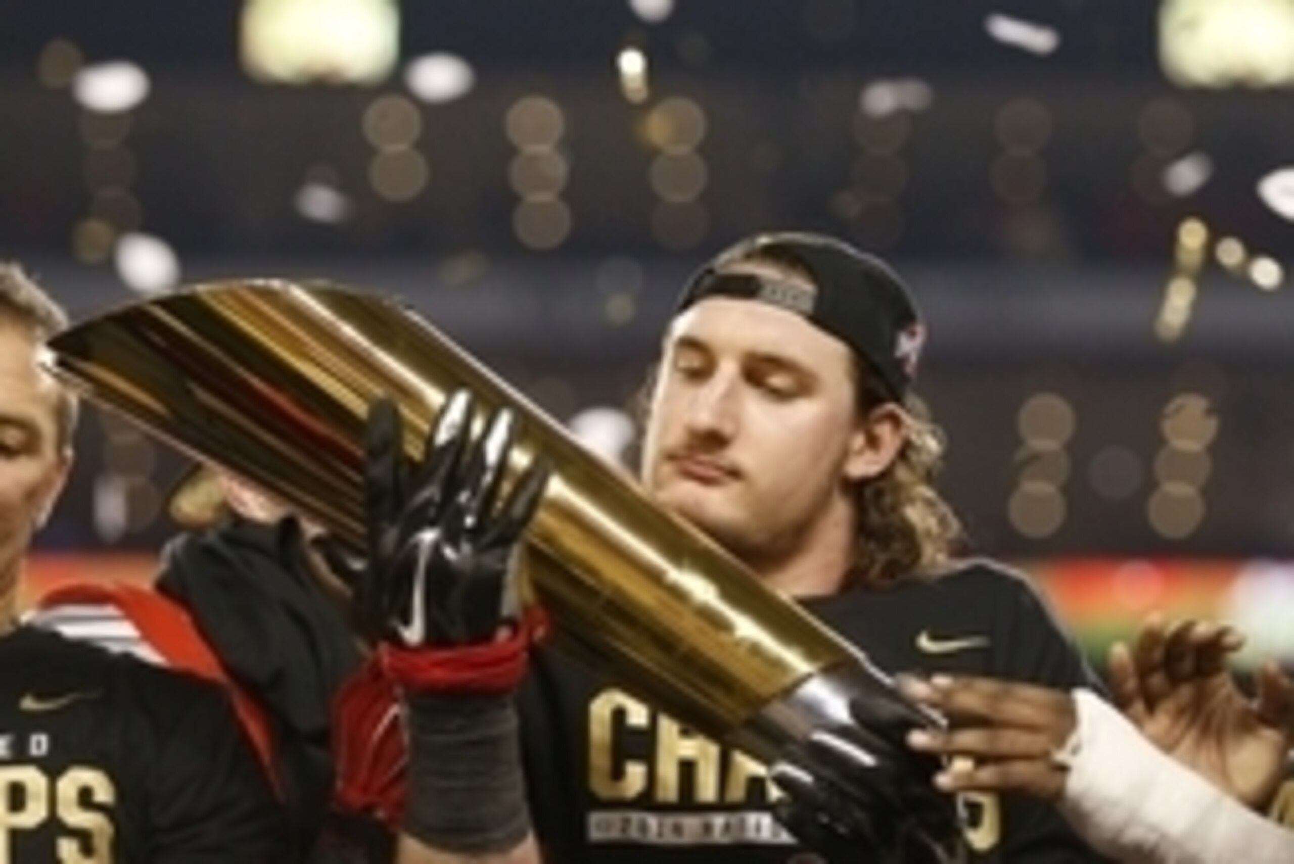 Jan 12, 2015; Arlington, TX, USA; Ohio State Buckeyes defensive end Joey Bosa holds the College Football Playoff trophy after the game against Oregon Ducks in the 2015 CFP National Championship Game at AT&T Stadium. Mandatory Credit: Matthew Emmons-USA TO