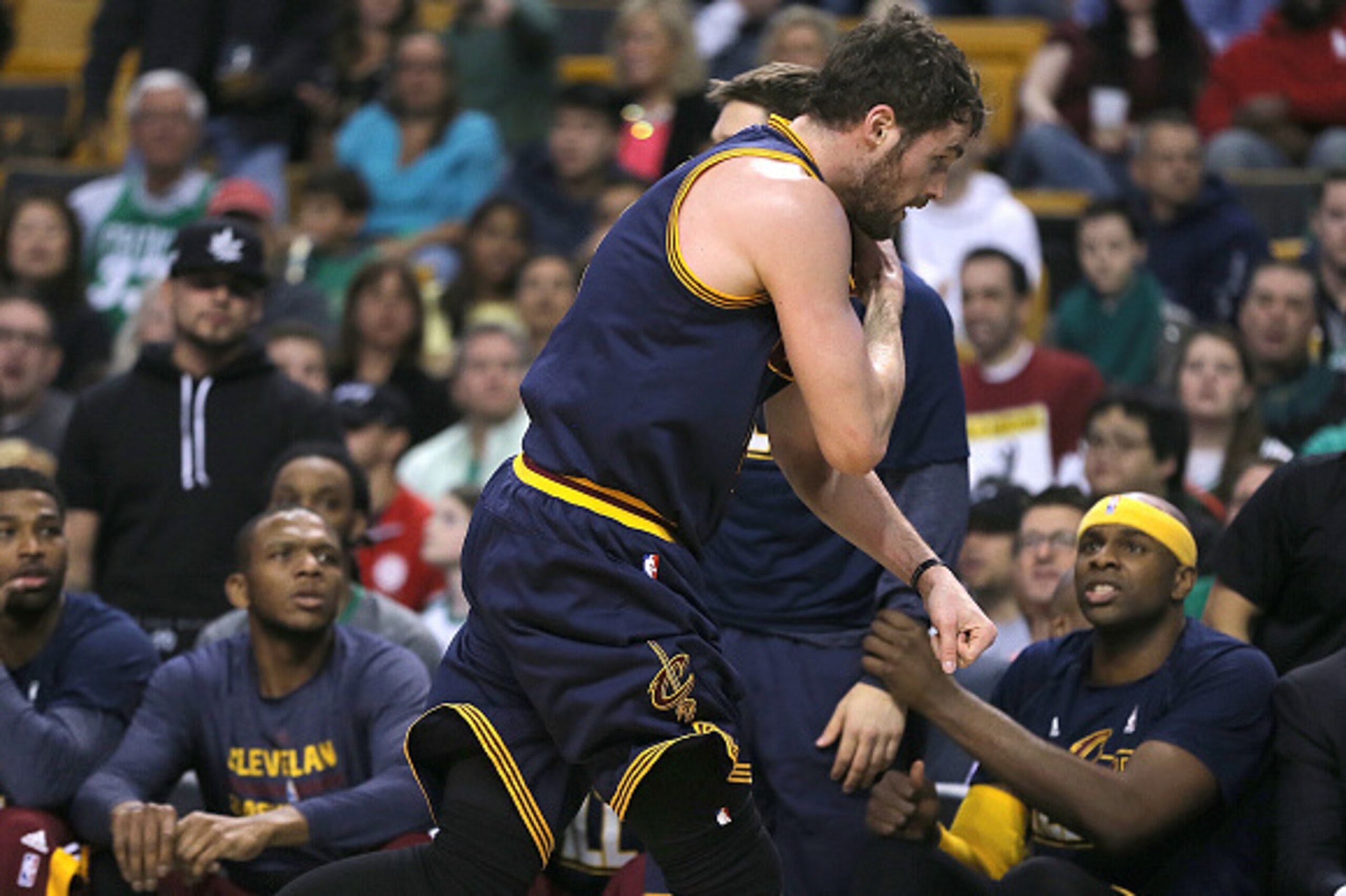 BOSTON, MA - APRIL 26: Kevin Love #0 of the Cleveland Cavaliers runs by teammates off of the court after an injury against the Boston Celtics in the first quarter in Game Four during the first round of the 2015 NBA Playoffs on April 26, 2015 at TD Garden 
