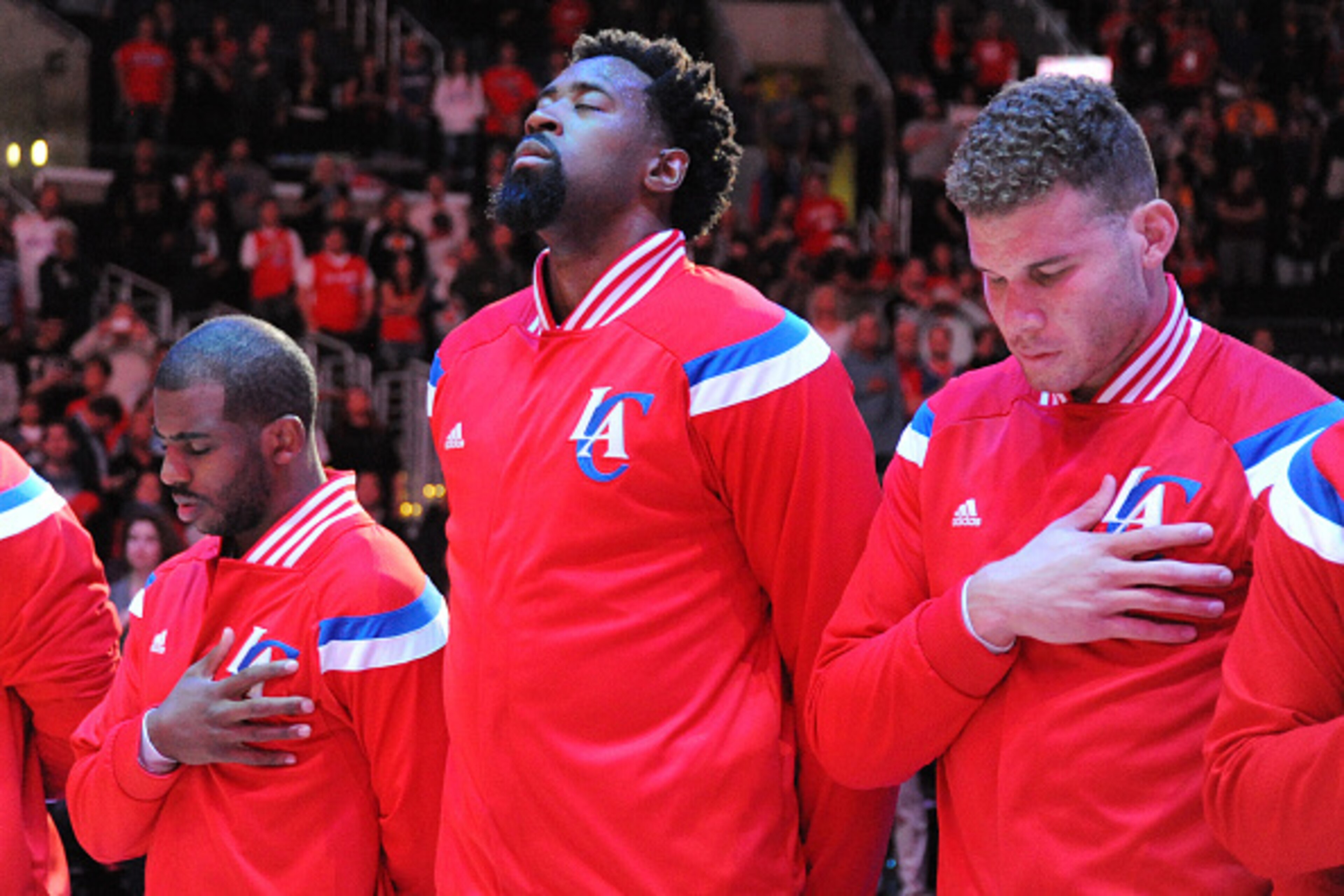 LOS ANGELES, CA - APRIL 07: Chris Paul #3, DeAndre Jordan #6, and Blake Griffin #32 of the Los Angeles Clippers stand for the national anthem before a game against the Los Angeles Lakers at STAPLES Center on April 07, 2015 in Los Angeles, California. NOTE