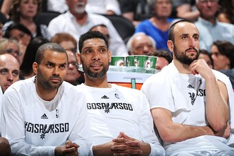 SAN ANTONIO - APRIL 24: Tony Parker #9 Tim Duncan #21 and Manu Ginobili #20 of the San Antonio Spurs during the game against the Los Angeles Clippers during Game Three of the Western Conference Quarterfinals at the AT&T Center on April 24, 2015 in San Ant