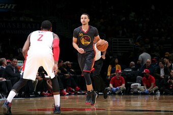 WASHINGTON, DC -  FEBRUARY 24: Stephen Curry #30 of the Golden State Warriors drives against the Washington Wizards on February 24, 2015 at Verizon Center in Washington, DC. NOTE TO USER: User expressly acknowledges and agrees that, by downloading and or 