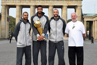 BERLIN - OCTOBER 6: Tony Parker #9, Tim Duncan #21, Manu Ginobili #20 and Gregg Popovich of the San Antonio Spurs pose for a photo during the 2014 Global Games on October 6, 2014 at Brandenberg Gate in Berlin, Germany. NOTE TO USER: User expressly acknowl