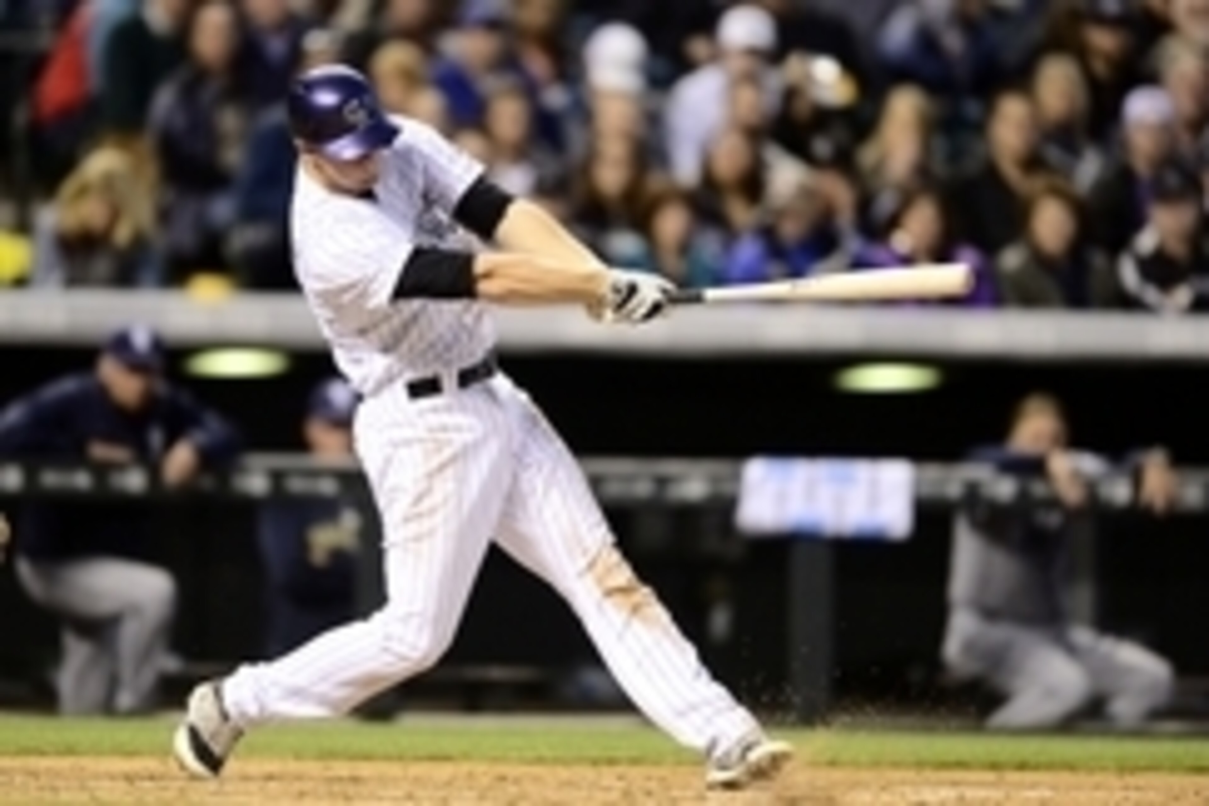 Apr 21, 2015; Denver, CO, USA; Colorado Rockies second baseman DJ LeMahieu (9) singles in the fourth inning against the San Diego Padres at Coors Field. Mandatory Credit: Ron Chenoy-USA TODAY Sports