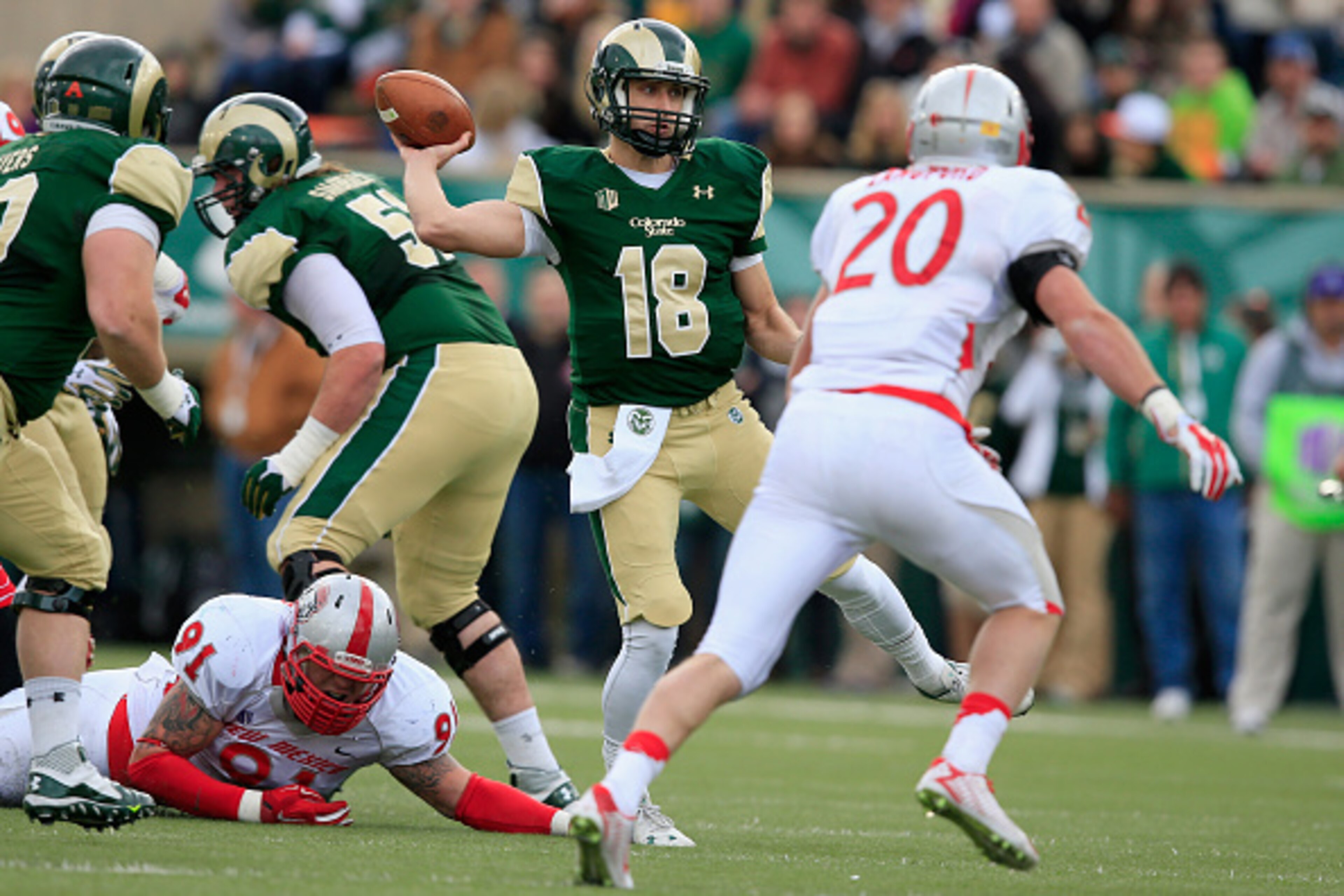 FORT COLLINS, CO - NOVEMBER 22:  Quarterback Garrett Grayson #18 of the Colorado State Rams delivers a pass against the New Mexico Lobos on November 22, 2014 in Fort Collins, Colorado. Colorado State defeated New Mexico 58-20.  (Photo by Doug Pensinger/Ge