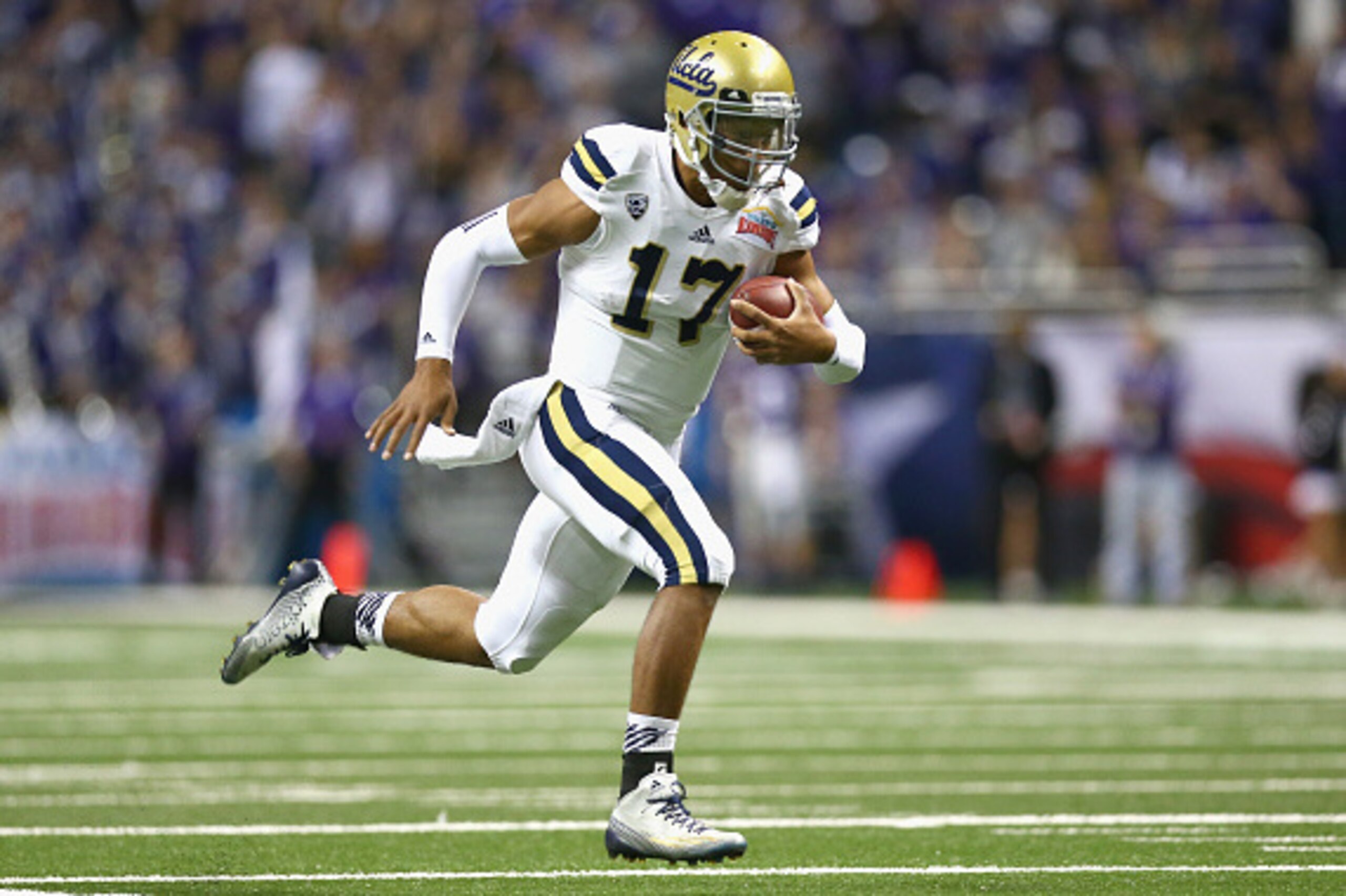 SAN ANTONIO, TX - JANUARY 02:  Brett Hundley #17 of the UCLA Bruins runs for a touchdown against the Kansas State Wildcats in the first quarter during the Valero Alamo Bowl at Alamodome on January 2, 2015 in San Antonio, Texas.  (Photo by Ronald Martinez/
