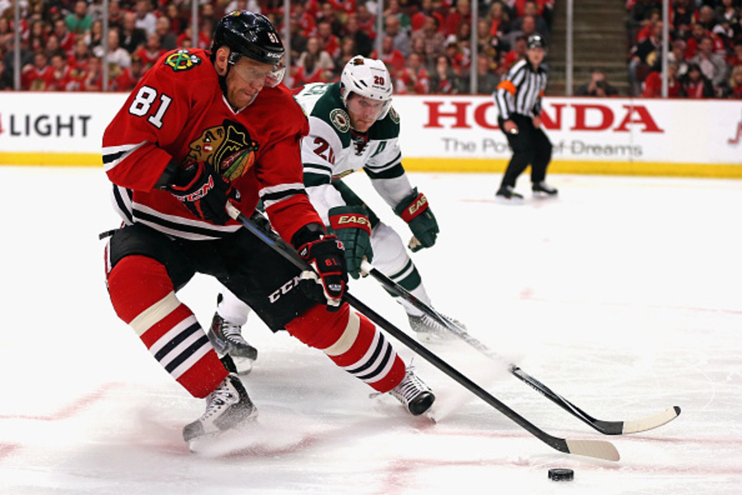 CHICAGO, IL - MAY 01: Marian Hossa #81 of the Chicago Blackhawks controls the puck under pressure from Ryan Suter #20 of the Minnesota Wild in Game One of the Western Conference Semifinals during the 2015 NHL Stanley Cup Playoffs at the United Center on M