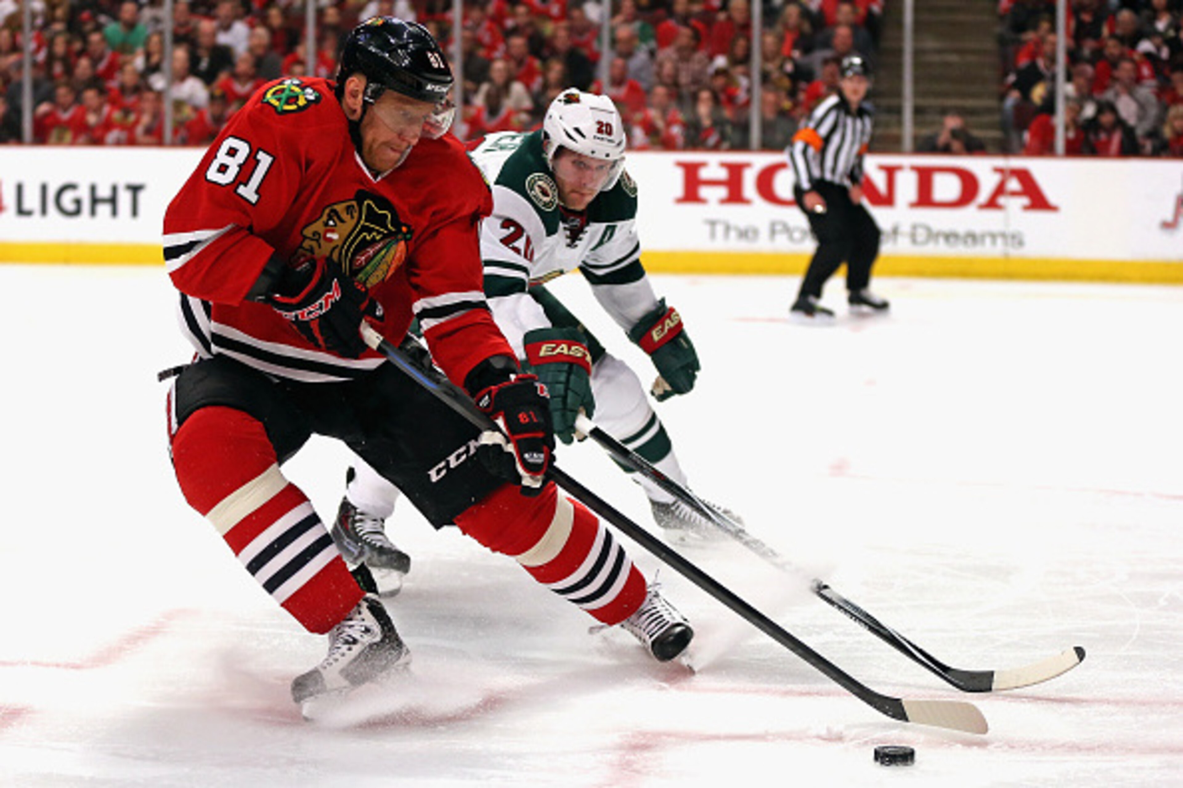 CHICAGO, IL - MAY 01: Marian Hossa #81 of the Chicago Blackhawks controls the puck under pressure from Ryan Suter #20 of the Minnesota Wild in Game One of the Western Conference Semifinals during the 2015 NHL Stanley Cup Playoffs at the United Center on M