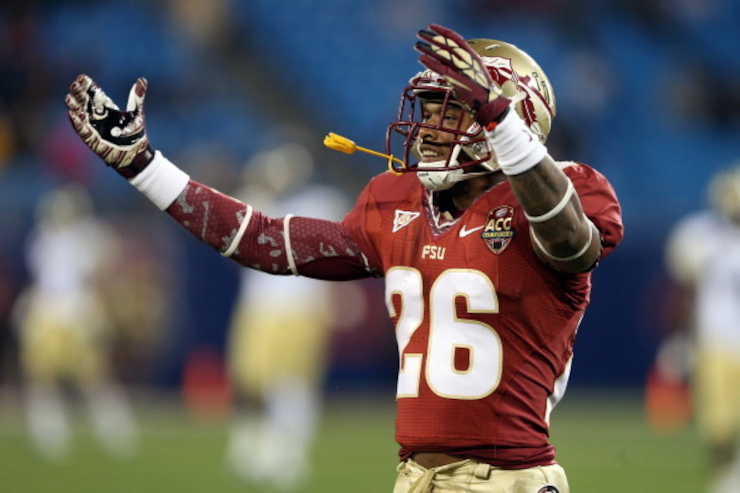 CHARLOTTE, NC - DECEMBER 01:  P.J. Williams #26 of the Florida State Seminoles reacts to the fans during the 2012 ACC Championship game against the Georgia Tech Yellow Jackets at Bank of America Stadium on December 1, 2012 in Charlotte, North Carolina.  (