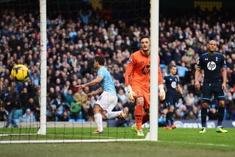 MANCHESTER, ENGLAND - NOVEMBER 24:  Sergio Aguero of Manchester City scores his team's third goal past goalkeeper Hugo Lloris of Tottenham Hotspur during the Barclays Premier League match between Manchester City and Tottenham Hotspur at Etihad Stadium on 