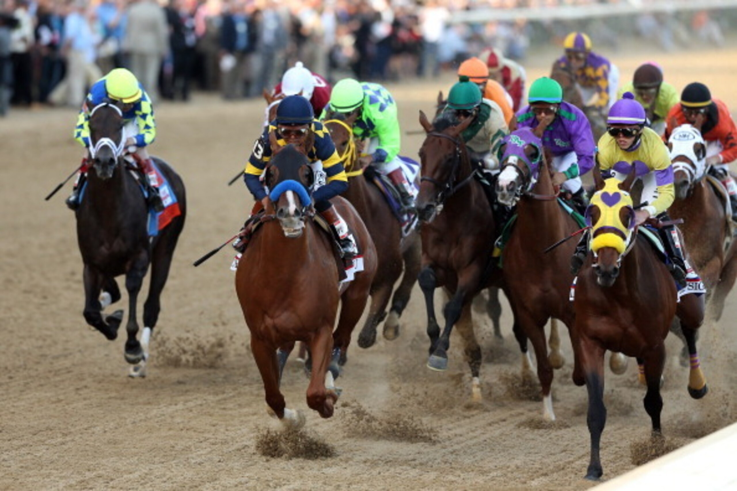 LOUISVILLE, KY - MAY 03:  Jockey Victor Espinoza guides California Chrome #5 to the finish line to win the 140th running of the Kentucky Derby at Churchill Downs on May 3, 2014 in Louisville, Kentucky.  (Photo by Matthew Stockman/Getty Images)