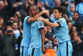 MANCHESTER, ENGLAND - APRIL 25:  Fernandinho of Manchester City celebrates his winning goal with Jesus Navas of Manchester City during the Barclays Premier League match between Manchester City and Aston Villa at Etihad Stadium on April 25, 2015 in Manches