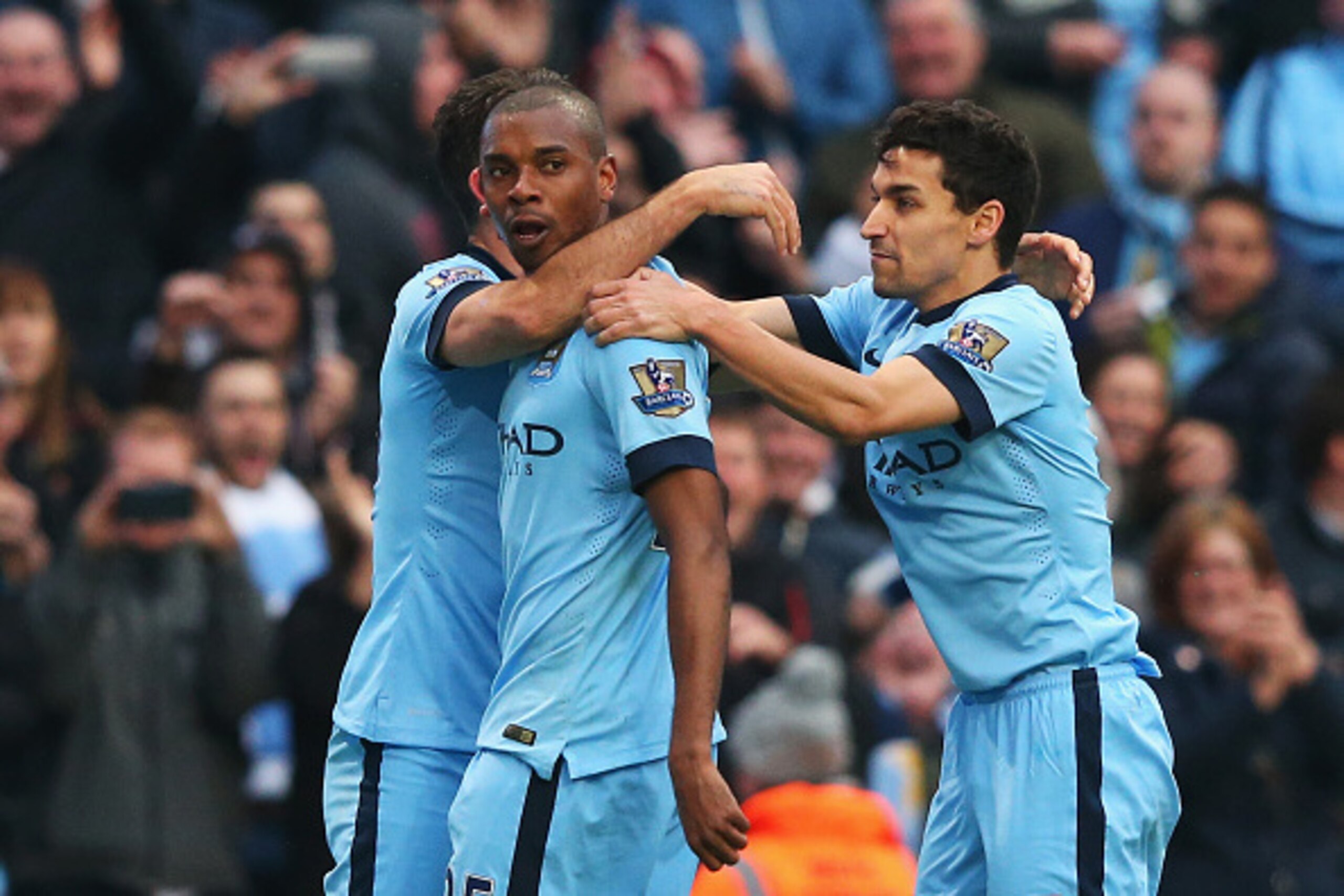 MANCHESTER, ENGLAND - APRIL 25:  Fernandinho of Manchester City celebrates his winning goal with Jesus Navas of Manchester City during the Barclays Premier League match between Manchester City and Aston Villa at Etihad Stadium on April 25, 2015 in Manches