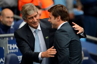 MANCHESTER, ENGLAND - OCTOBER 18:  Mauricio Pochettino the manager of Spurs is greeted by Manuel Pellegrini the manager of Manchester City during the Barclays Premier League match between Manchester City and Tottenham Hotspur at Etihad Stadium on October 