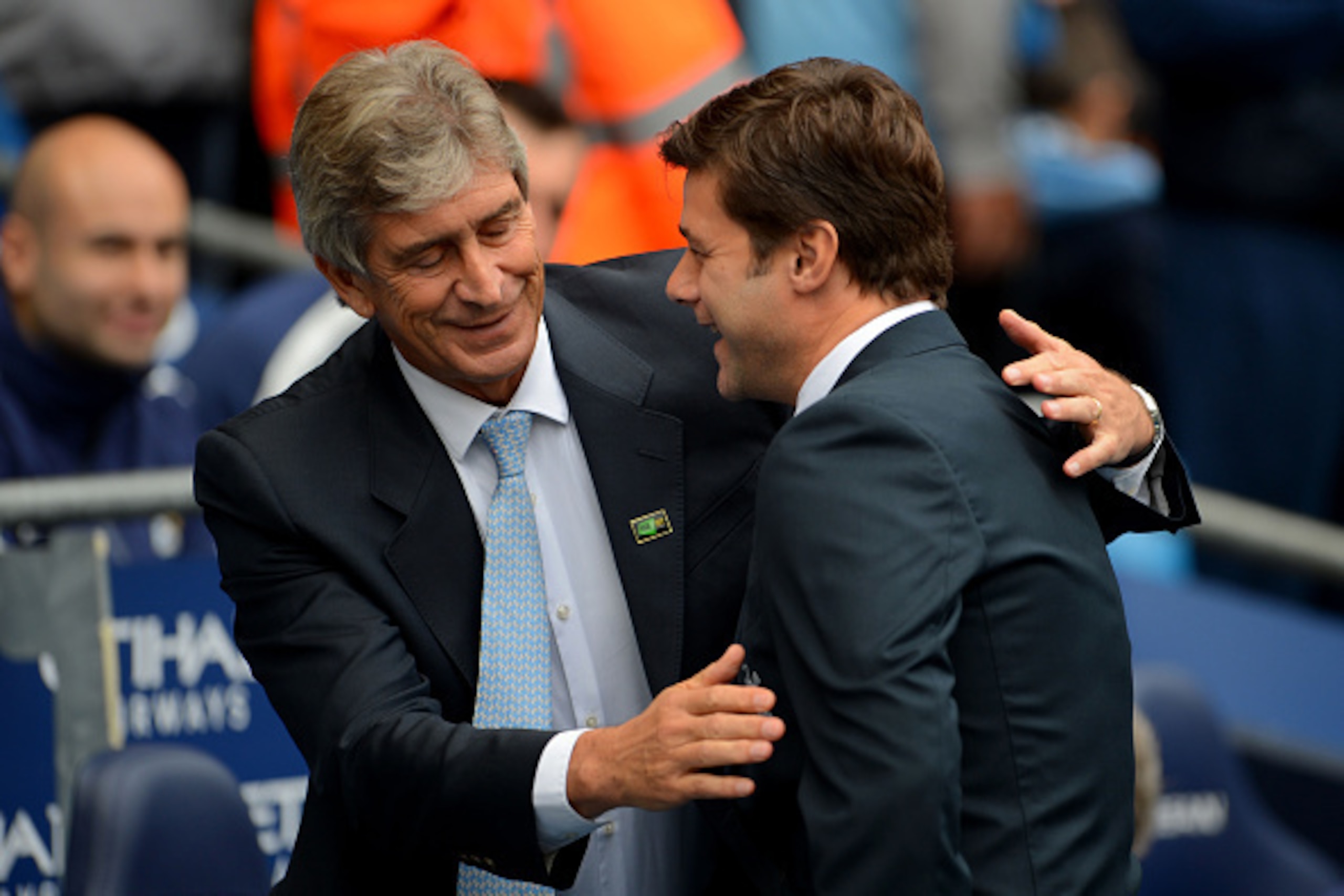 MANCHESTER, ENGLAND - OCTOBER 18:  Mauricio Pochettino the manager of Spurs is greeted by Manuel Pellegrini the manager of Manchester City during the Barclays Premier League match between Manchester City and Tottenham Hotspur at Etihad Stadium on October 