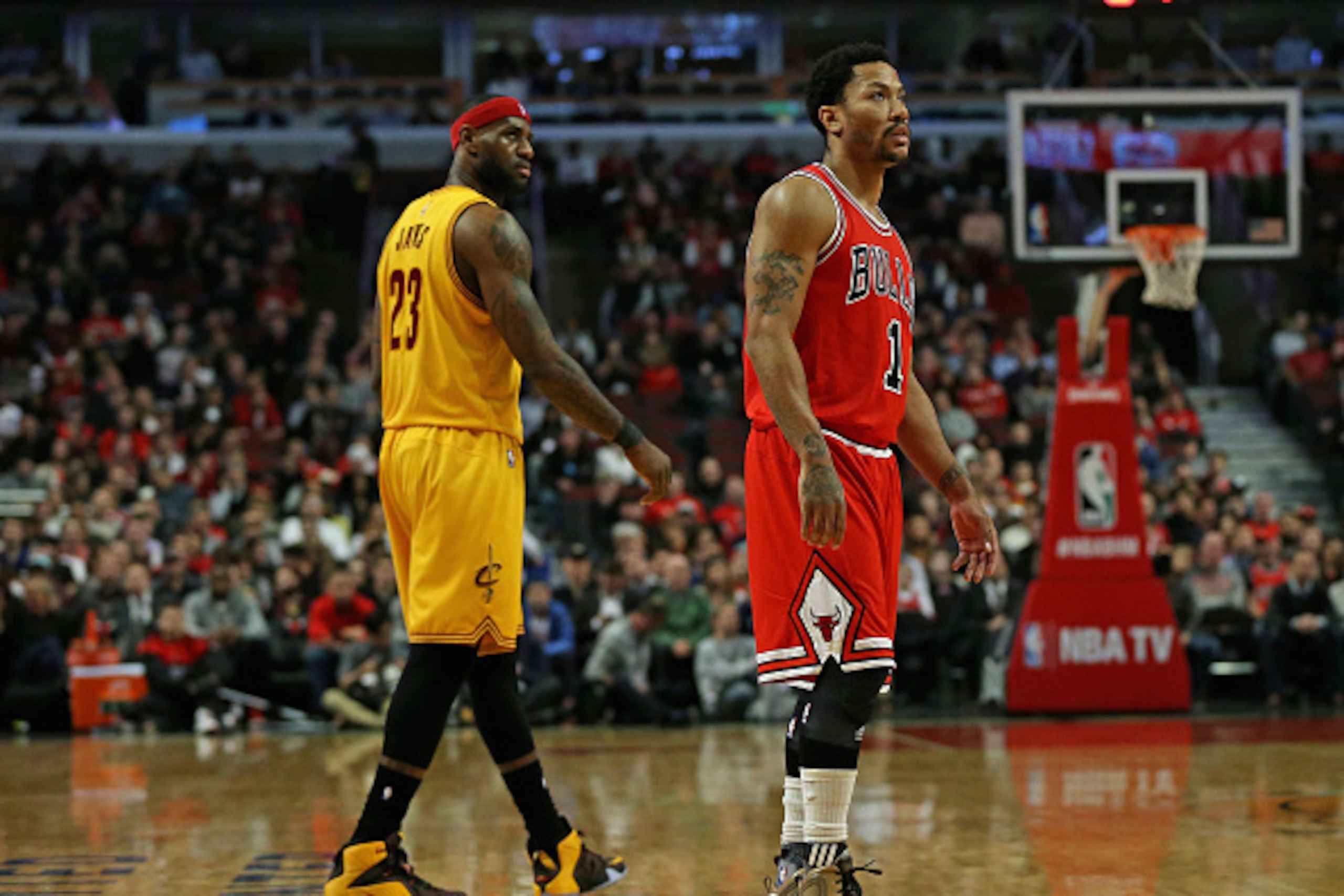 CHICAGO, IL - FEBRUARY 12: Derrick Rose #1 of the Chicago Bulls and LeBron James #23 of the Cleveland Cavaliers watch as a player shoots a free-throw at the United Center on February 12, 2015 in Chicago, Illinois. The Bulls defeated the Cavaliers 113-98. 