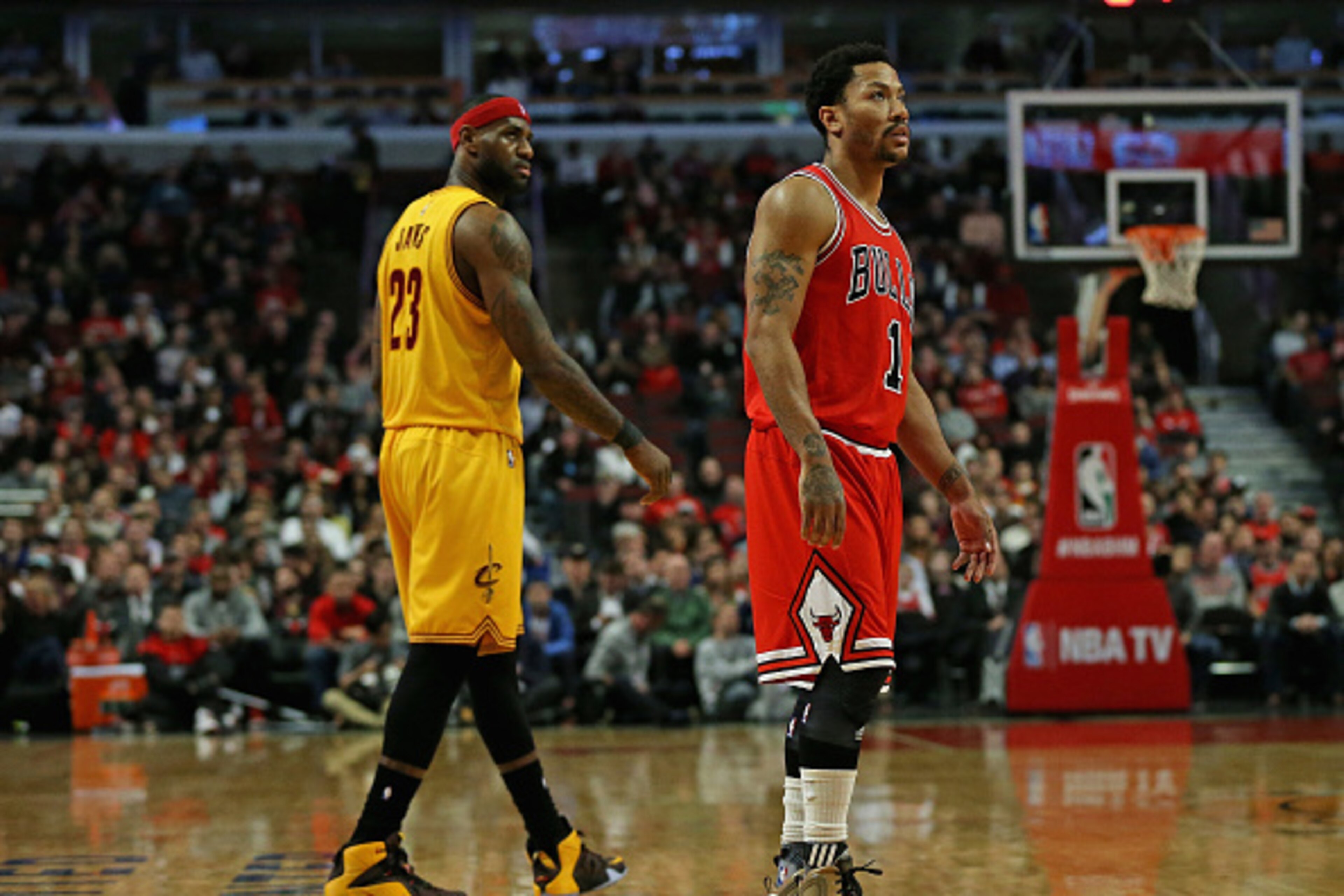 CHICAGO, IL - FEBRUARY 12: Derrick Rose #1 of the Chicago Bulls and LeBron James #23 of the Cleveland Cavaliers watch as a player shoots a free-throw at the United Center on February 12, 2015 in Chicago, Illinois. The Bulls defeated the Cavaliers 113-98. 