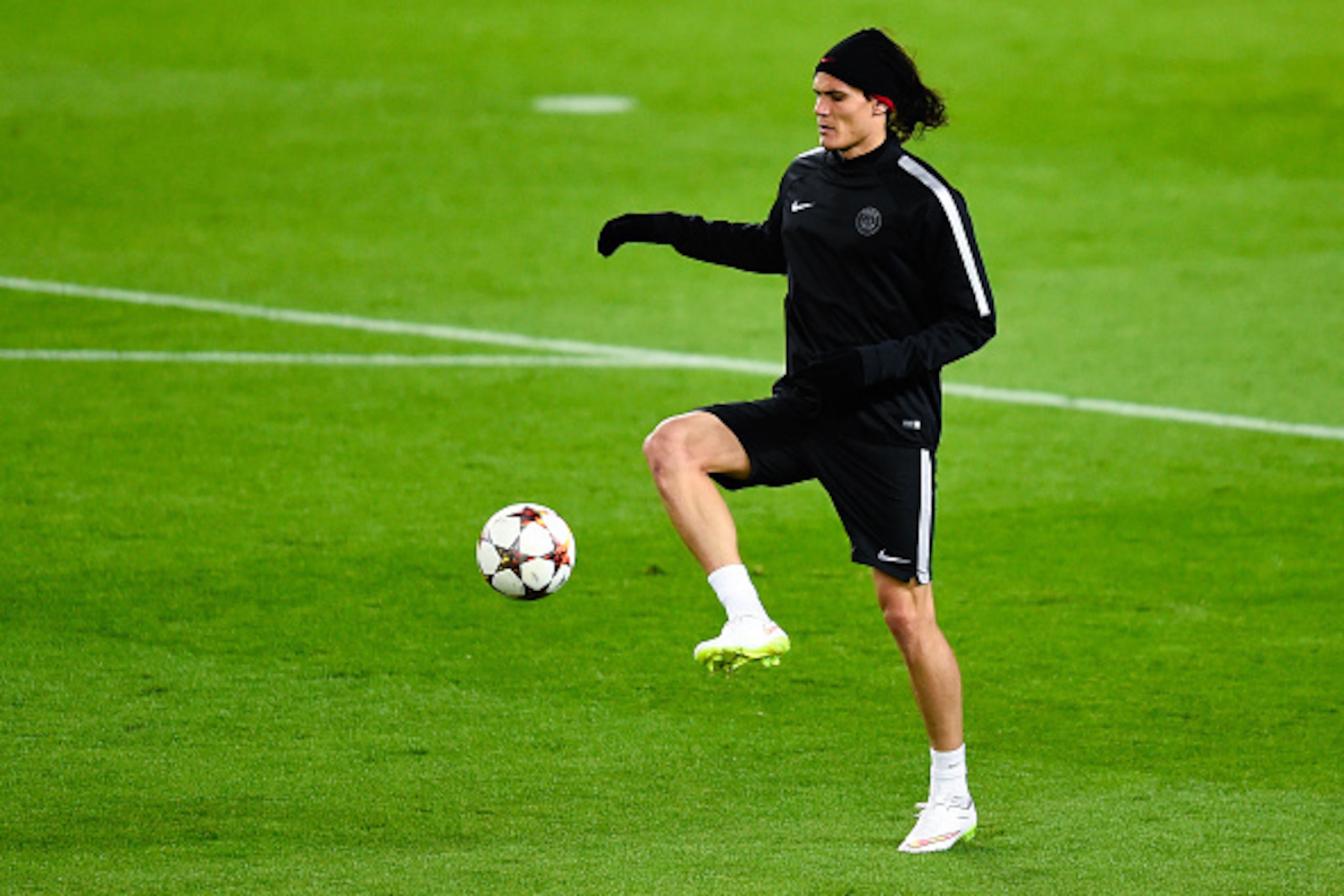 BARCELONA, SPAIN - DECEMBER 09:  Edinson Cavani of Paris Saint-Germain FC in action during training session ahead of their UEFA Champions League Group F match against FC Barcelona at the Camp Nou stadium on December 9, 2014 in Barcelona, Spain.  (Photo by