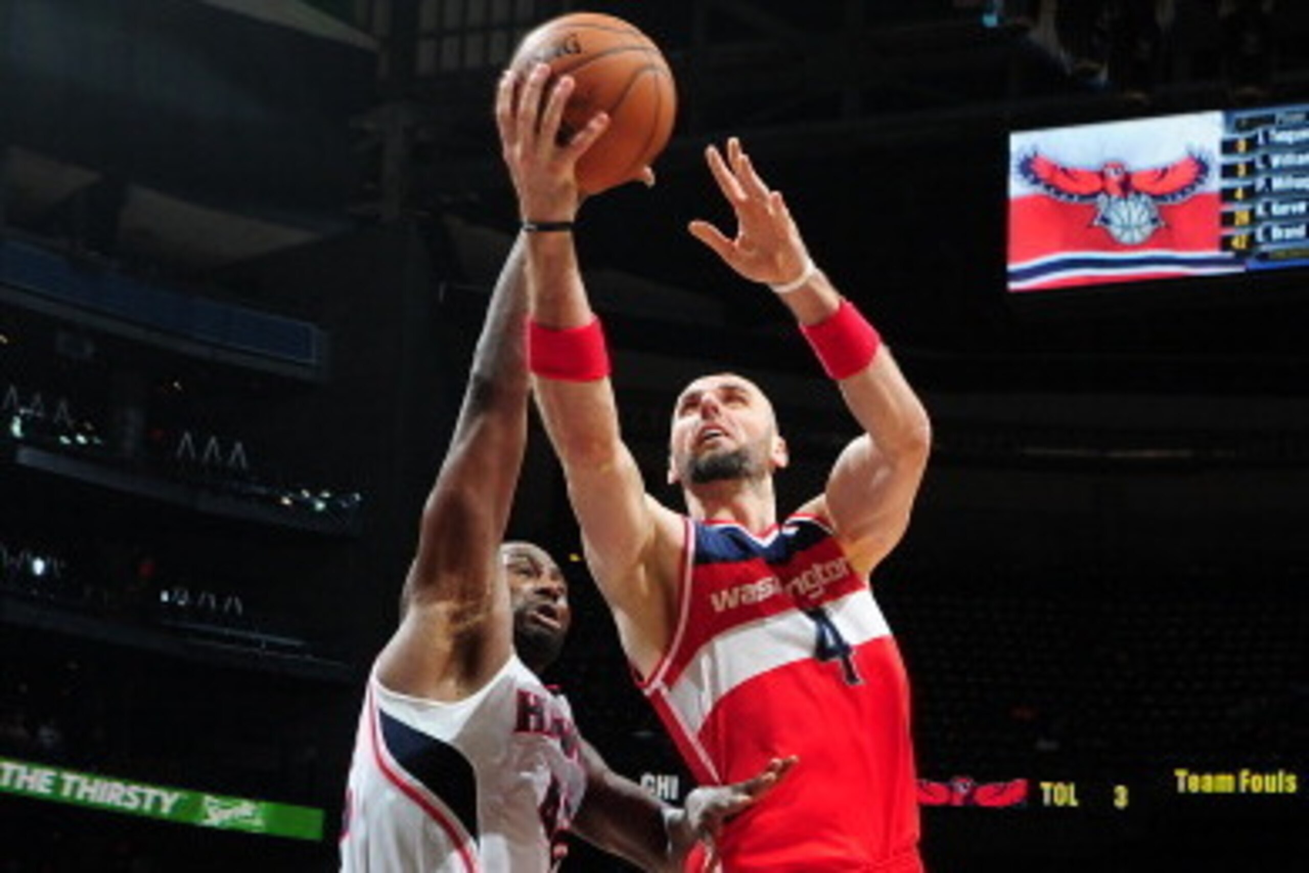 ATLANTA, GA - FEBRUARY 19: Marcin Gortat #4 of the Washington Wizards shoots against the Atlanta Hawks on February 19, 2014 at Philips Arena in Atlanta, Georgia.  NOTE TO USER: User expressly acknowledges and agrees that, by downloading and/or using this 