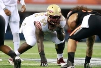Aug 30, 2014; Arlington, TX, USA; Florida State Seminoles guard Tre' Jackson (54) on the line of scrimmage against the Oklahoma State Cowboys  at AT&T Stadium. Florida State beat Oklahoma State 37-31. Mandatory Credit: Tim Heitman-USA TODAY Sports